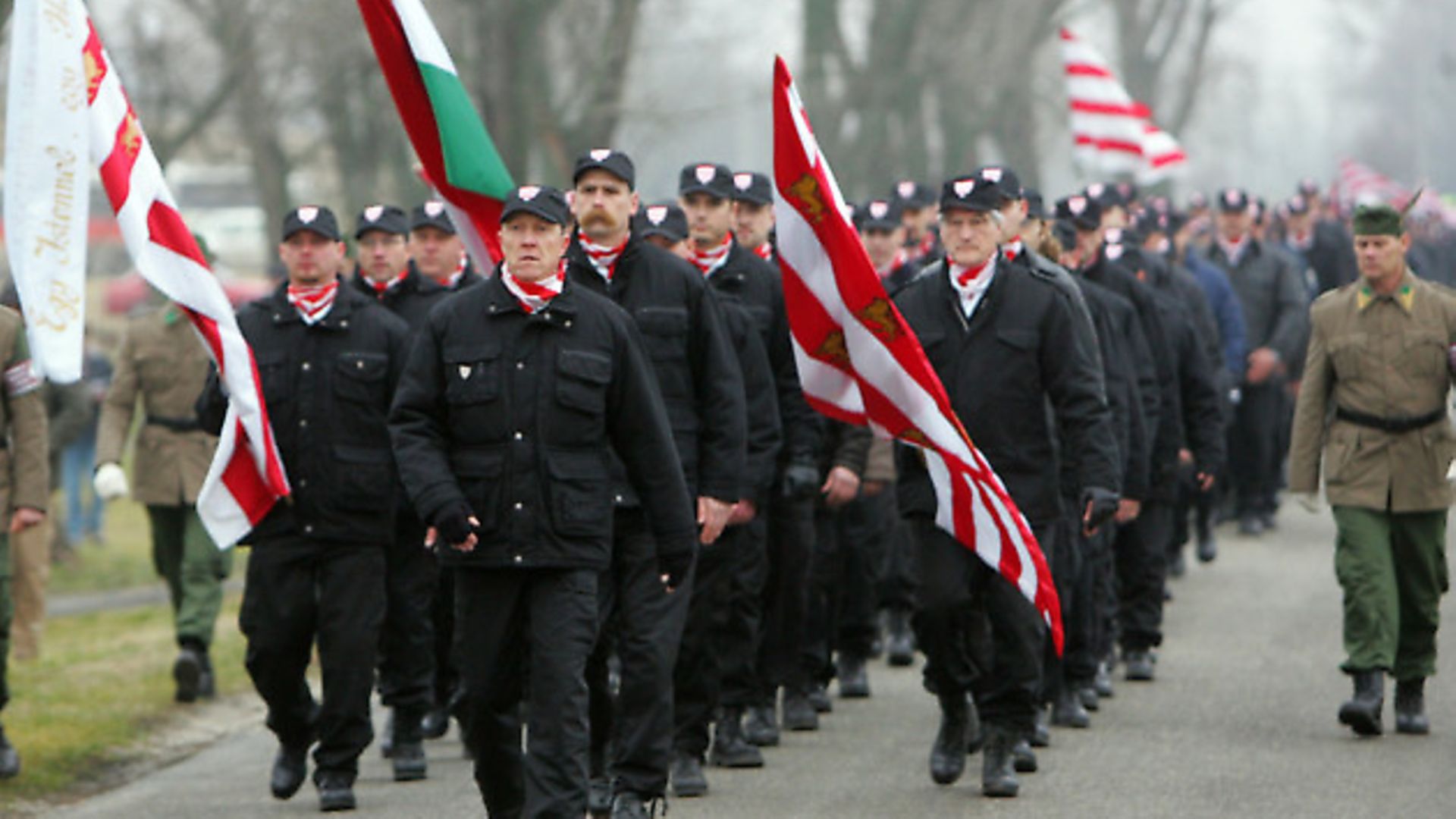 A few hundred members of the Magyar Garda, or Hungarian Guard and sympathizers of the far-right 'Jobbik Party' march in the center of Tatarszentgyory village, 60 km south-west from Budapest 09 December 2007 during their demonstration against alleged criminal activities conducted by gypsies. - Credit: AFP/Getty Images