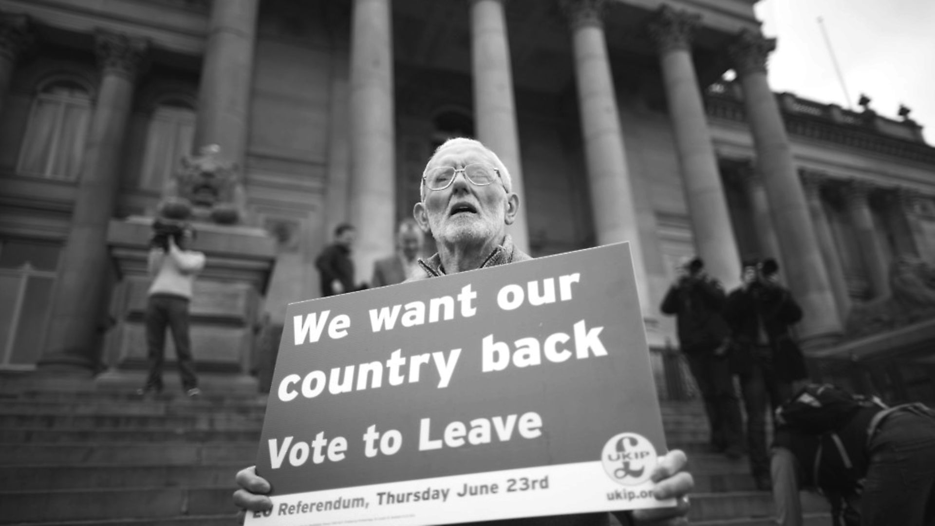 BOLTON, ENGLAND - MAY 25:  A Vote to Leave campaigner holds a placard as Leader of the United Kingdom Independence Party (UKIP), Nigel Farage campaigns for votes to leave the European Union in the referendum on May 25, 2016 in Bolton, England. Nigel Farage took his battle bus to Bolton encouraging British people to vote to leave the EU on 23rd June 2016.  (Photo by Christopher Furlong/Getty Images) - Credit: Getty Images