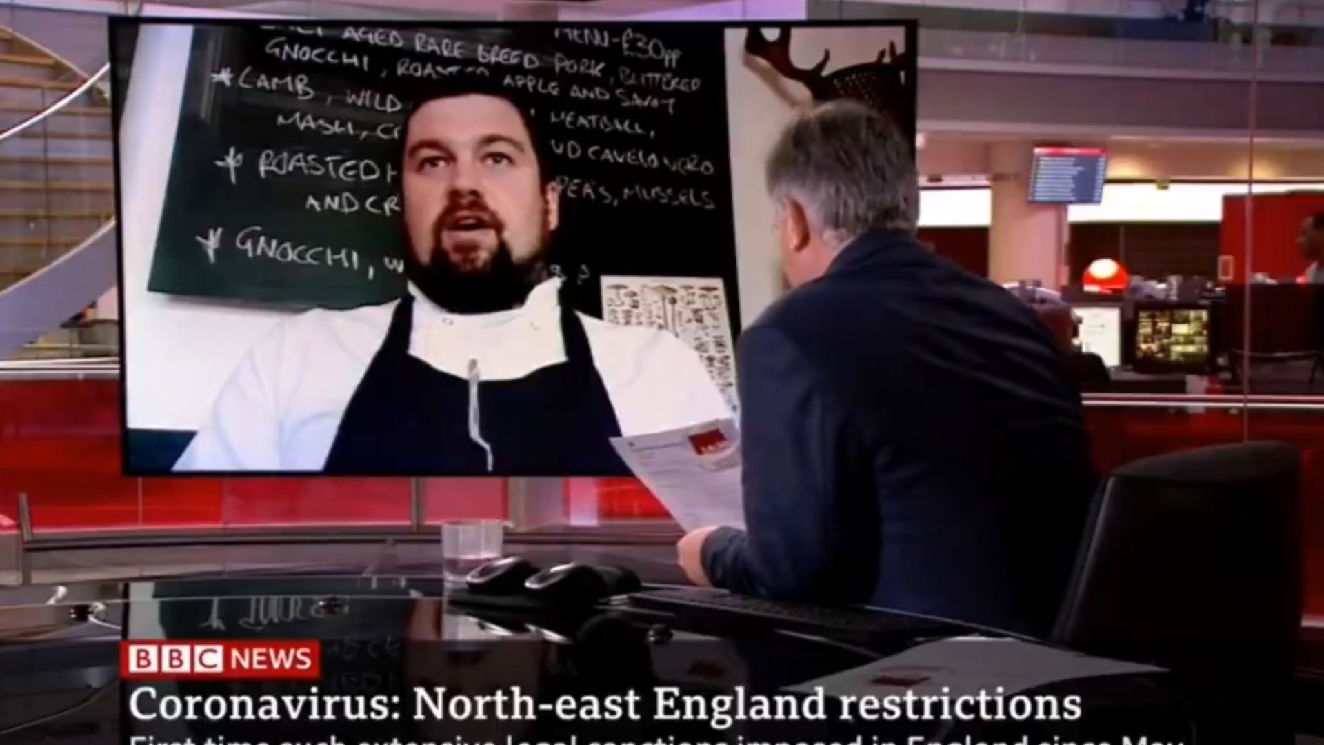 Presenter Simon McCoy tries to block the chart out of shot - Credit: BBC