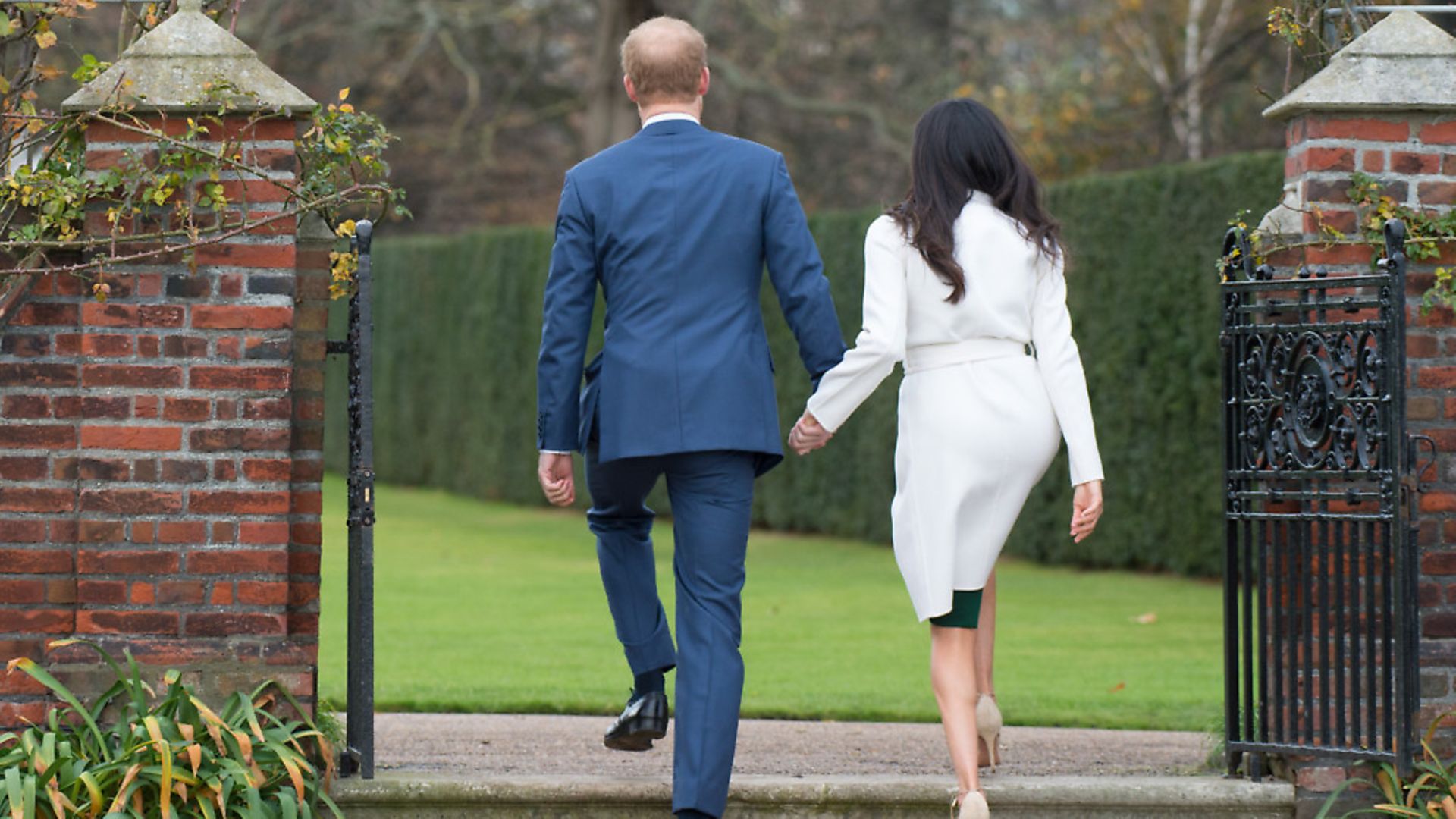 Prince Harry and Meghan Markle in the Sunken Garden at Kensington Palace. Picture: PA - Credit: EMPICS Entertainment