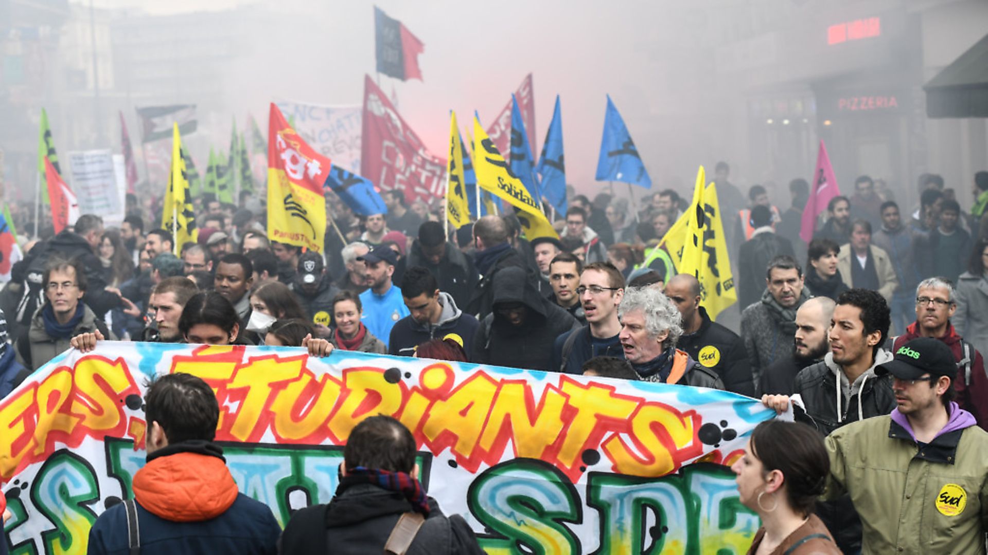 Protesters walk behind a banner during a protest march by railway workers and other labor union members in Paris, France, on Tuesday April 3, 2018. (Photo by Julien Mattia/NurPhoto/Sipa USA) - Credit: SIPA USA/PA Images