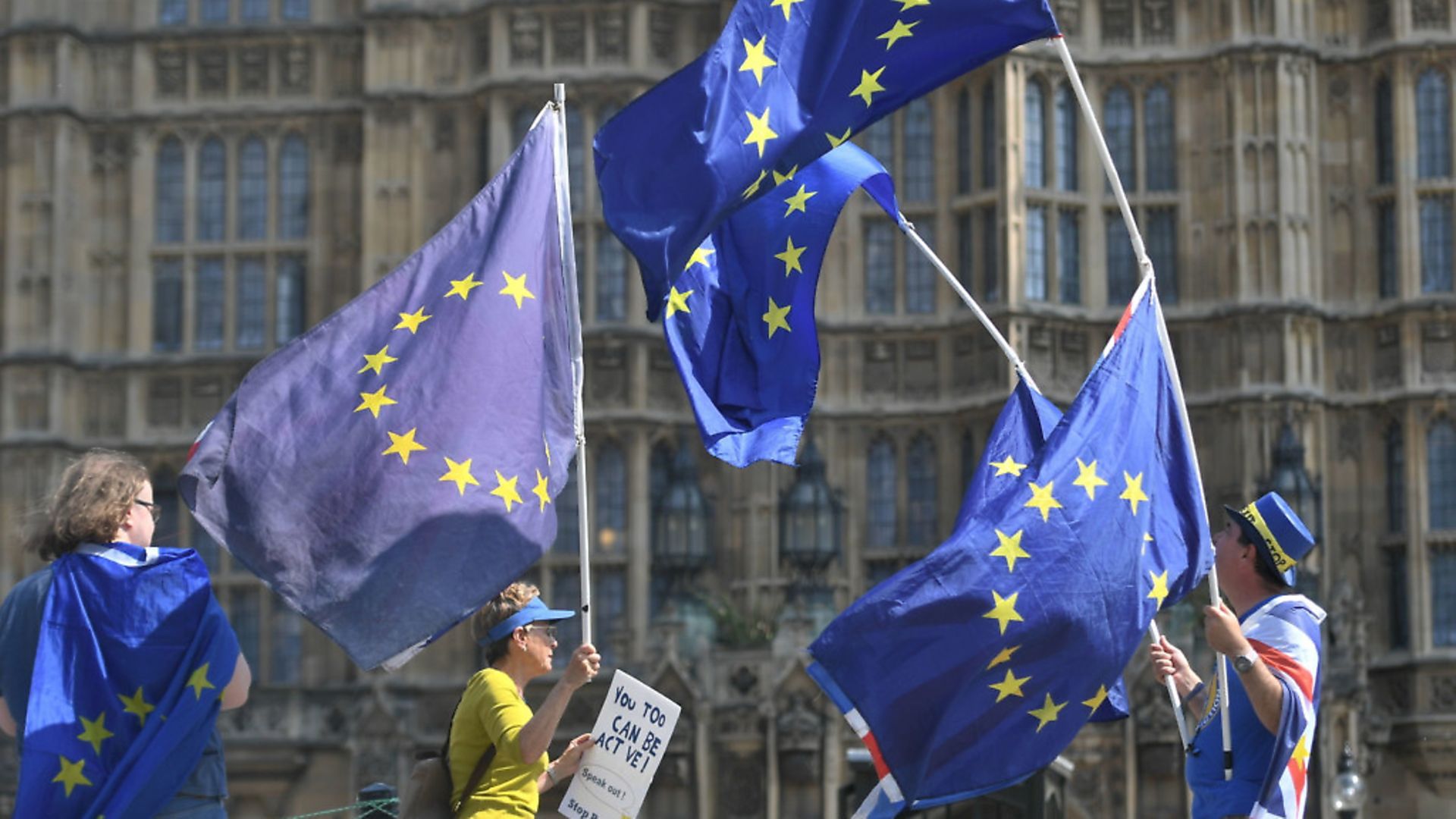Activists wave European Union and Union flags outside the Houses of Parliament in Westminster
Photo: PA / Victoria Jones - Credit: PA Wire/PA Images
