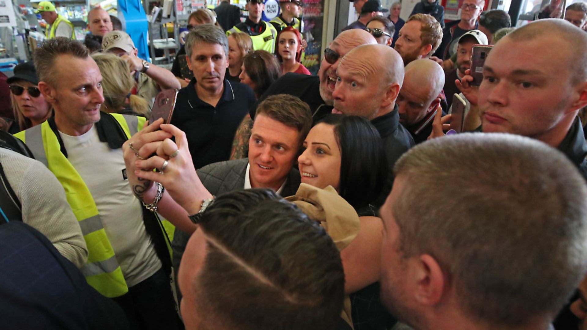 Tommy Robinson (centre) surrounded by supporters at City Thameslink railway station. Photograph: Yui Mok/PA Wire - Credit: PA
