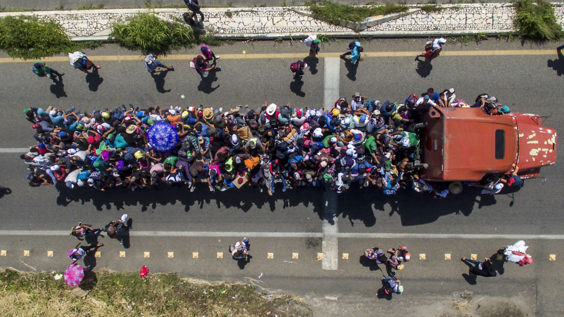 Aerial view of Honduran migrants onboard a truck as they take part in a caravan heading to the US, in the outskirts of Tapachula, Mexico. Picture by PEDRO PARDO/AFP - Credit: AFP/Getty Images