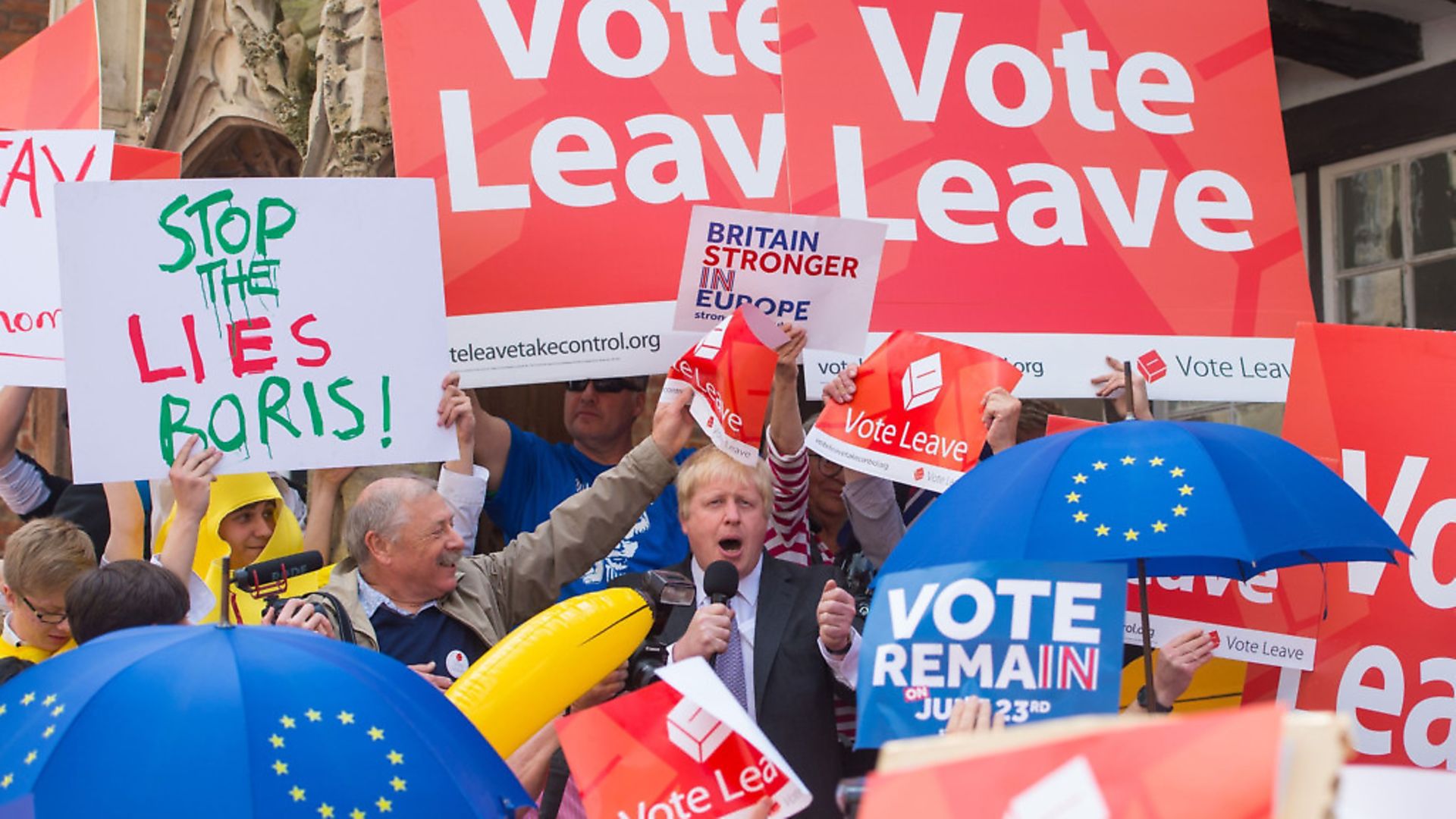 Boris Johnson is surrounded by Vote Leave and Vote Remain activists as he speaks in Winchester, as part of his tour on the Vote Leave campaign bus. PHOTO: PA - Credit: PA WIRE