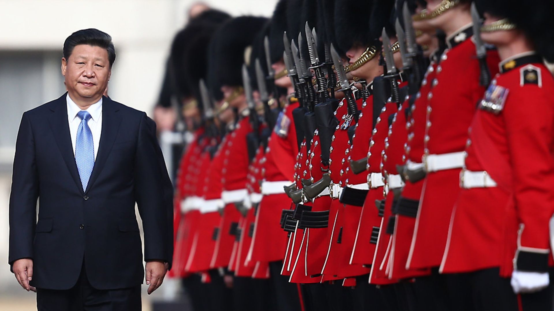 Chinas President Xi Jinping reviews a guard of honour on his state visit to London in 2015 Photo: Getty Images - Credit: Getty Images