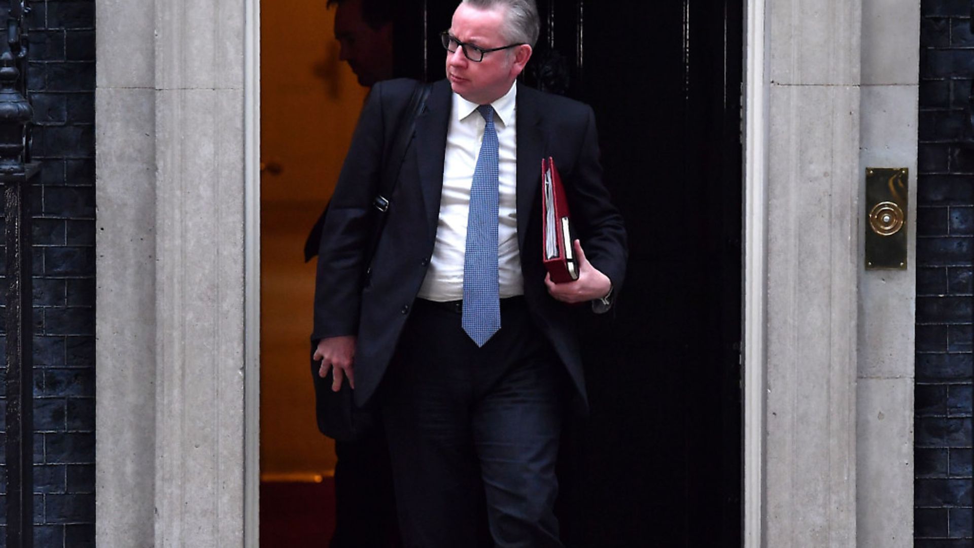 Britain's Environment, Food and Rural Affairs Secretary Michael Gove leaves after an emergency cabinet meeting at 10 Downing Street. Photograph: Ben Stanstall / Getty. - Credit: AFP/Getty Images