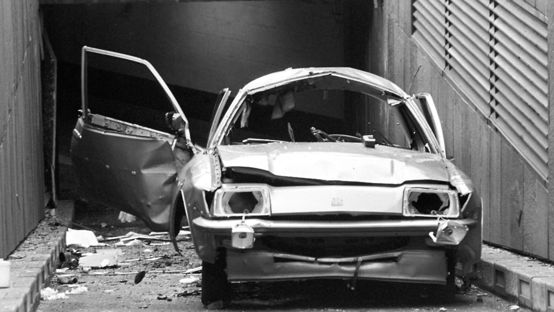 The remains of Airey Neave's car on the underground car park ramp at the House of Commons. Photo: PA - Credit: PA Archive/PA Images