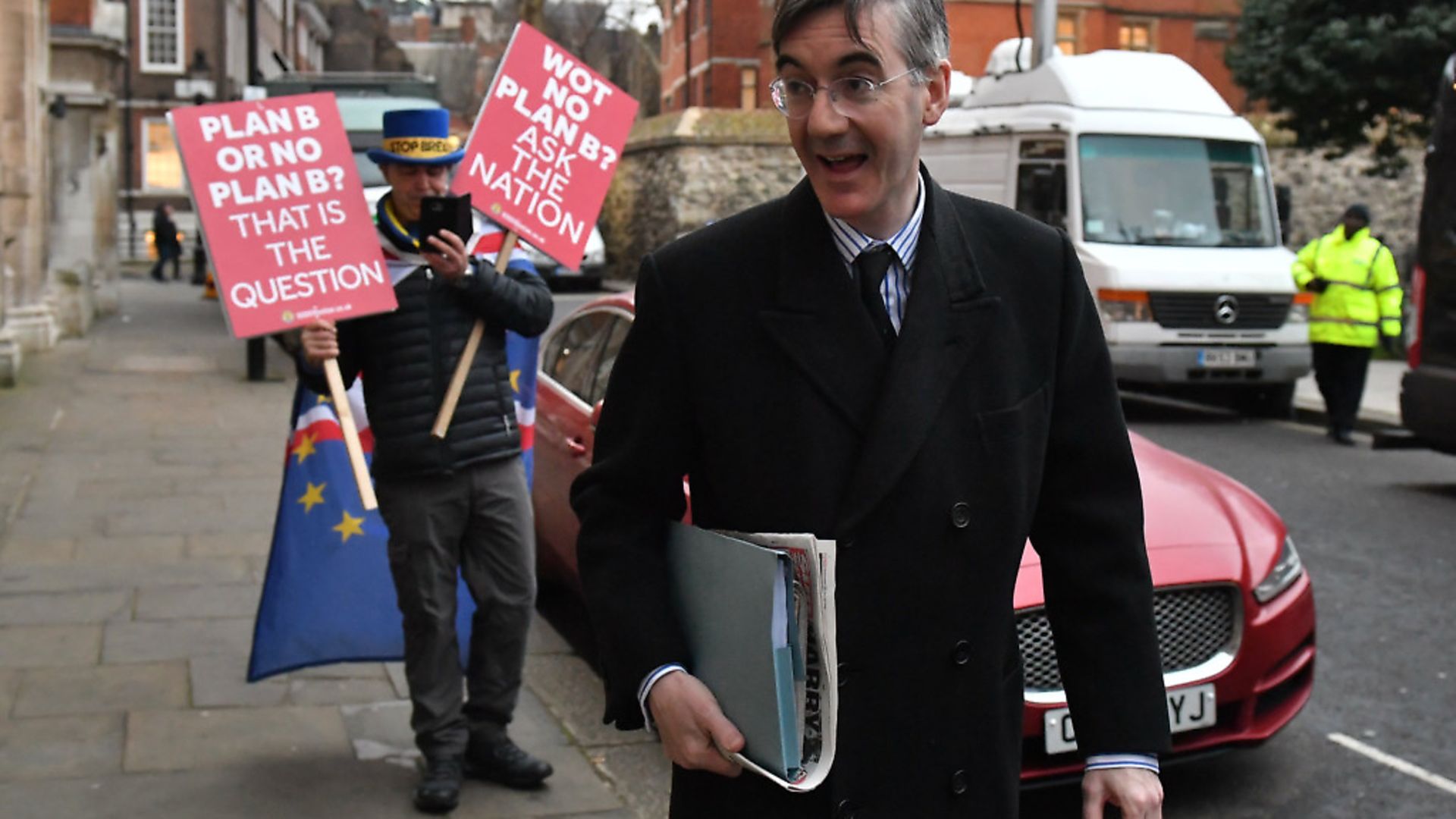 Jacob Rees-Mogg in Westminster with an anti-Brexit protestor. Photograph: Dominic Lipinski/PA. - Credit: PA Wire/PA Images