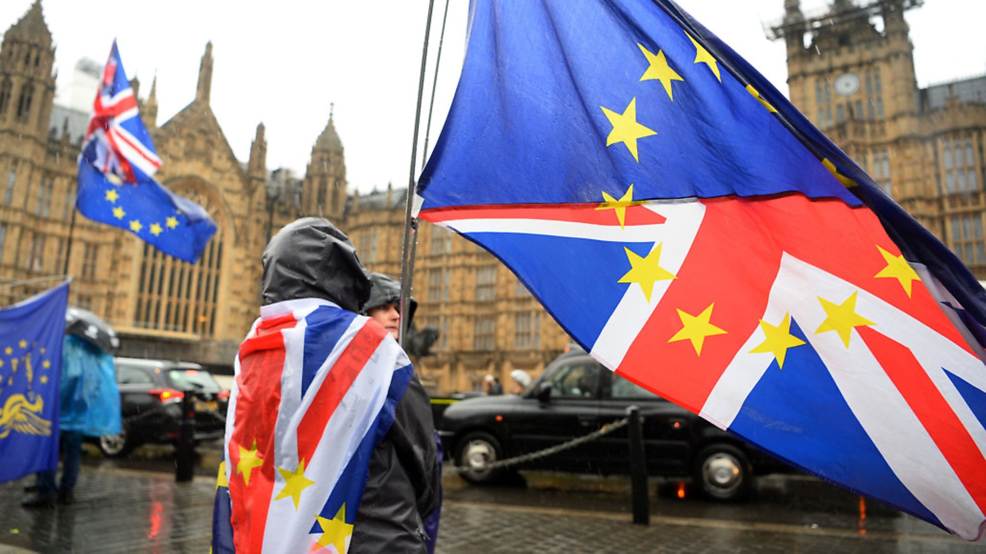 Anti Brexit supporters in the rain in Westminster. Photograph: Kirsty O'Connor/PA Wire - Credit: PA