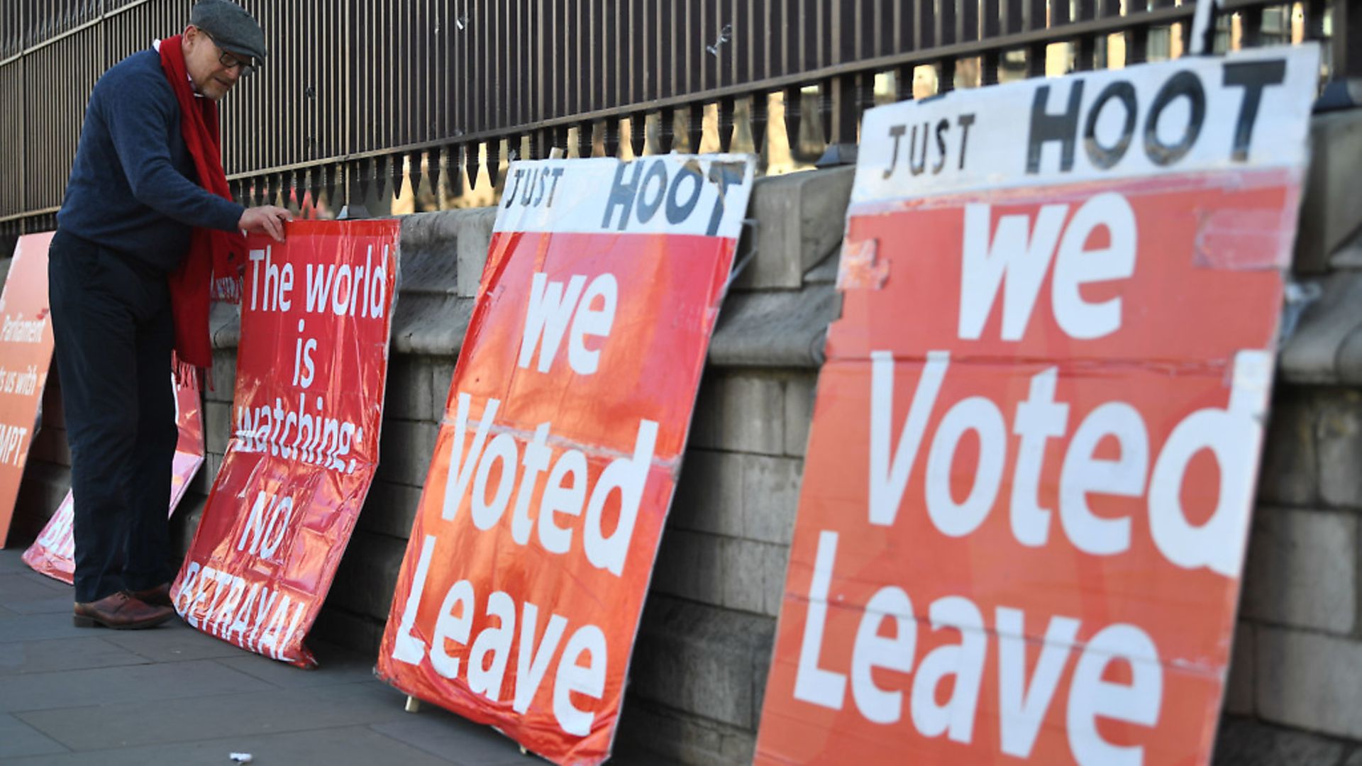 A pro-Brexit demonstrator adjusts his placards in Westminster ahead of a protest. Photograph: Victoria Jones/PA Wire. - Credit: PA