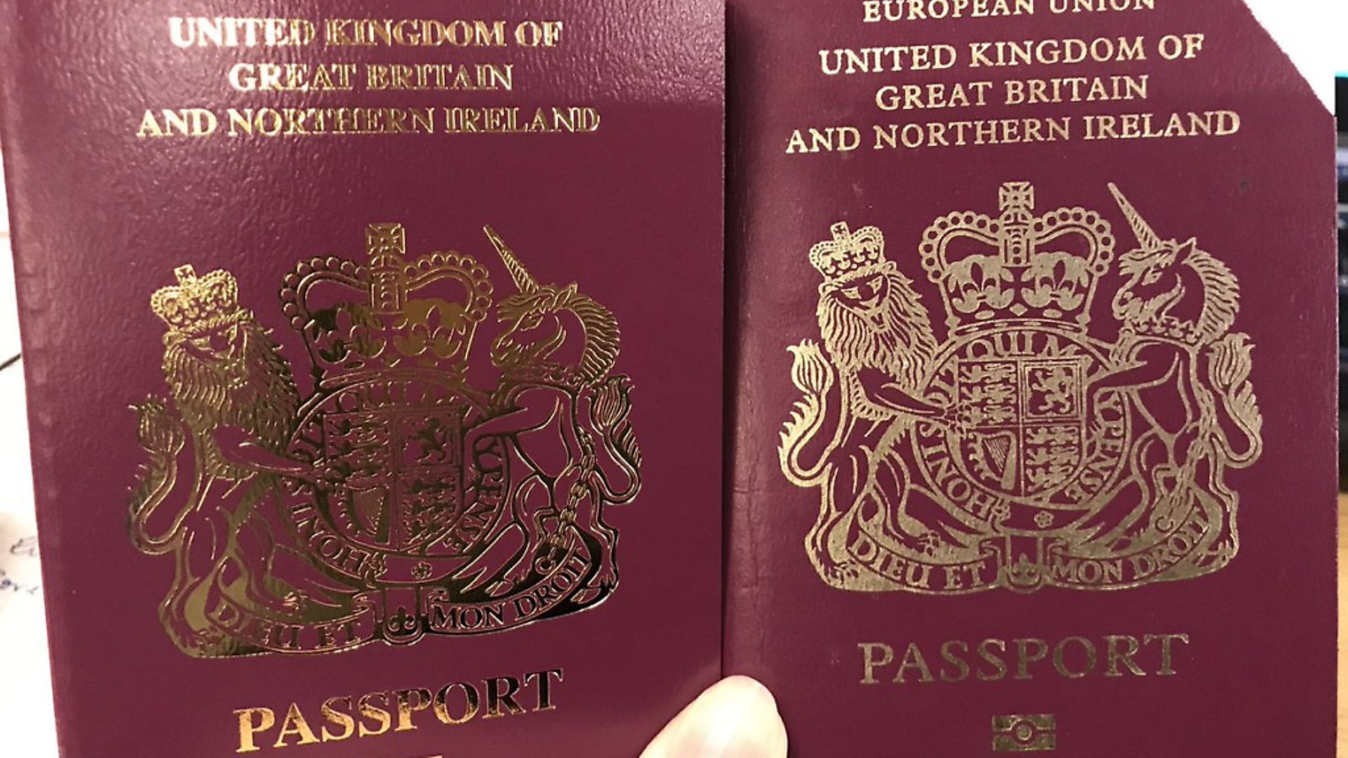 Handout photo taken from the twitter feed of SpinHBarone of her new passport (left) and her old passport (right). British passports without the words "European Union" on the front cover have been issued despite the Brexit delay. Photograph: @SpinHBarone/PA Wire. - Credit: PA