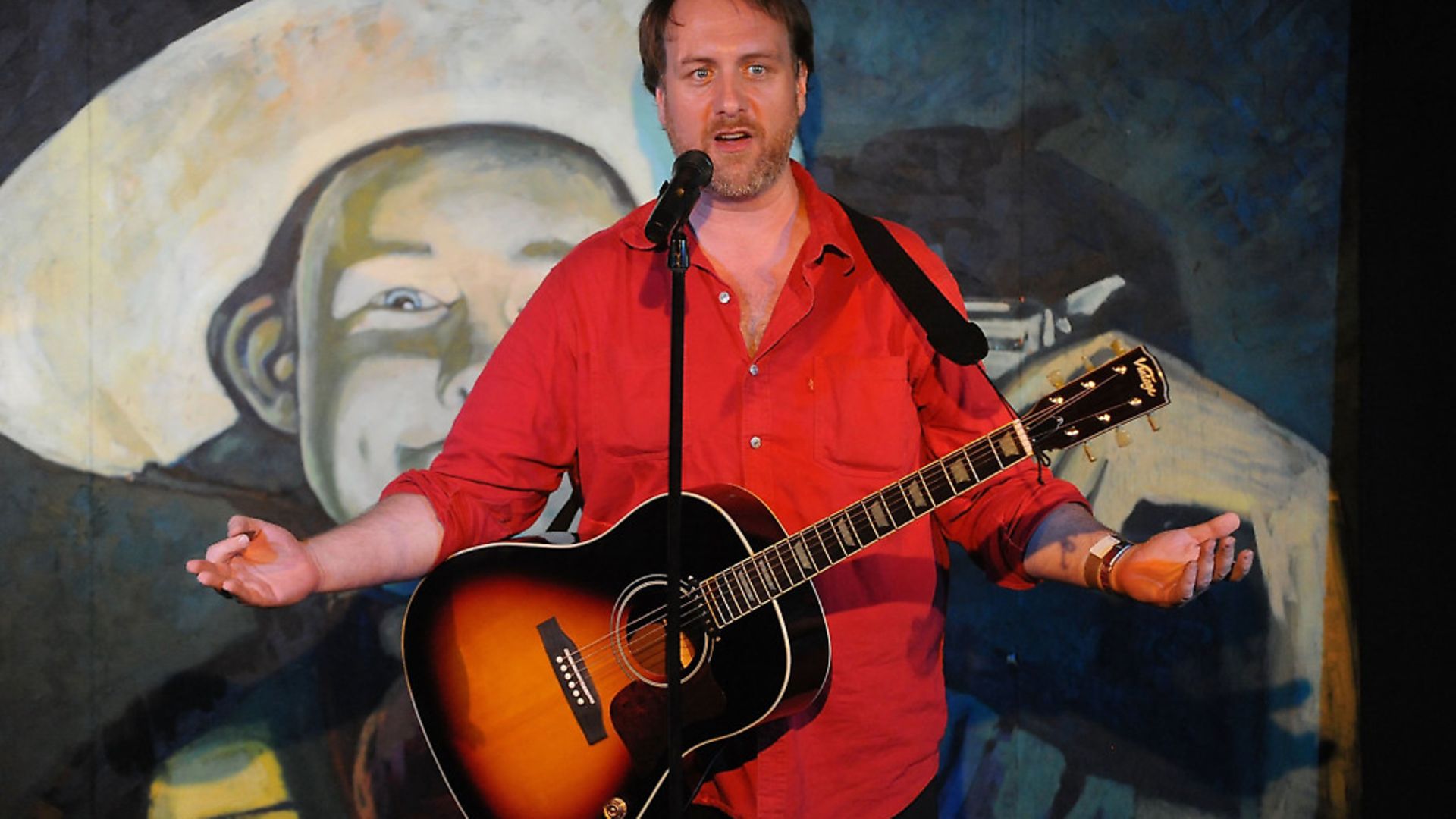 Mitch Benn performs during at The Edinburgh Festival Fringe in 2013. He believes there are similar parallels which can be drawn from comedians and politicians trying to attract an audience.  Photo: Scott Campbell/Getty Images - Credit: Getty Images