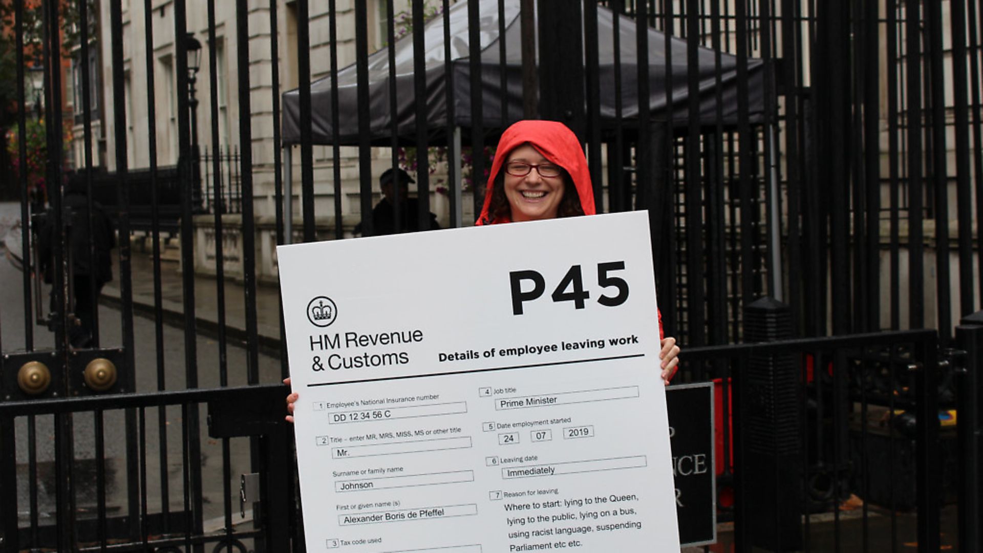 An activist tries to deliver Boris Johnson his P45. Photograph: Kate Plummer/Scram News. - Credit: Archant