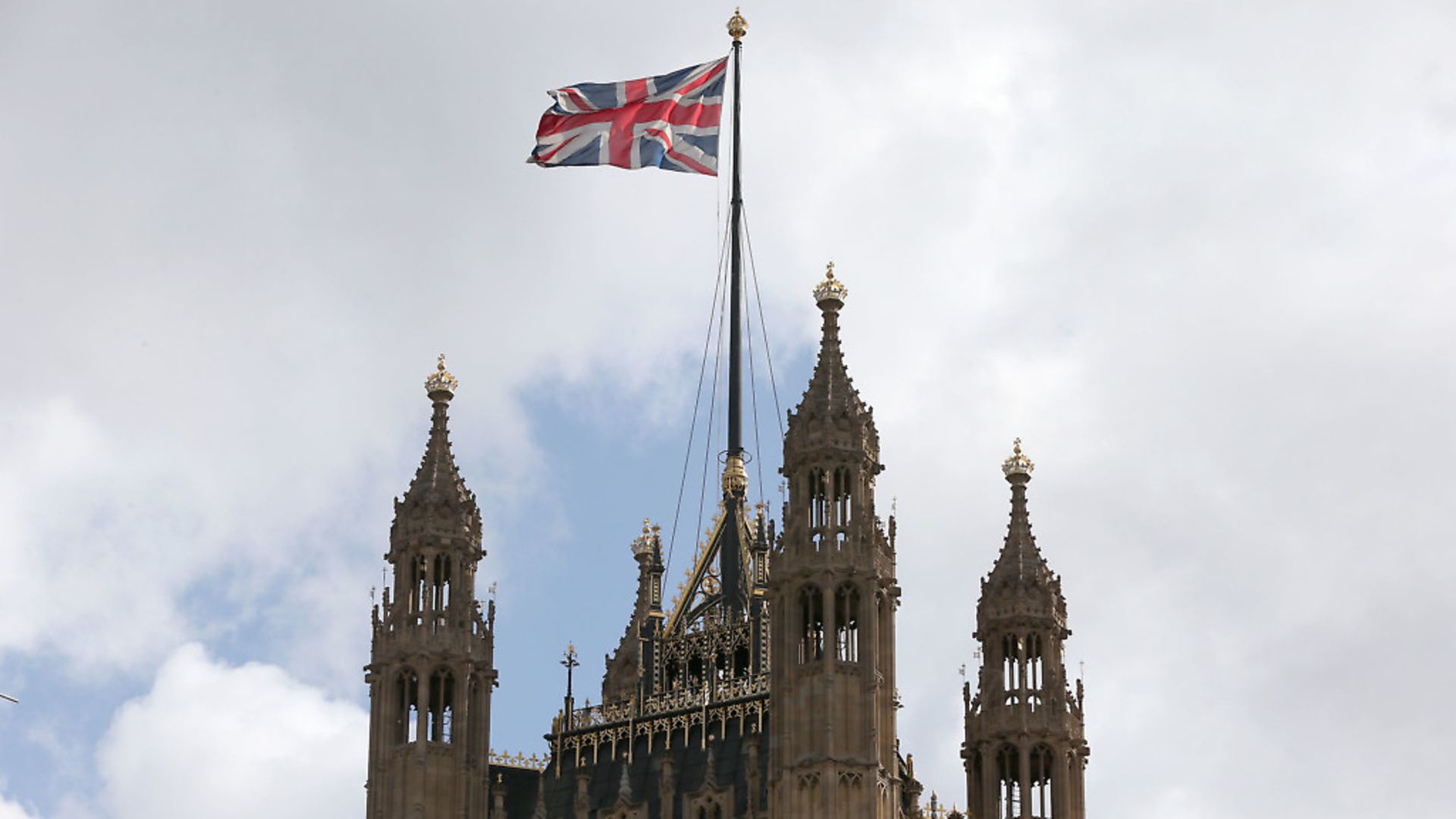 A union flag flying from the Houses of Parliament in Westminster. Photograph: Jonathan Brady/PA Wire. - Credit: PA