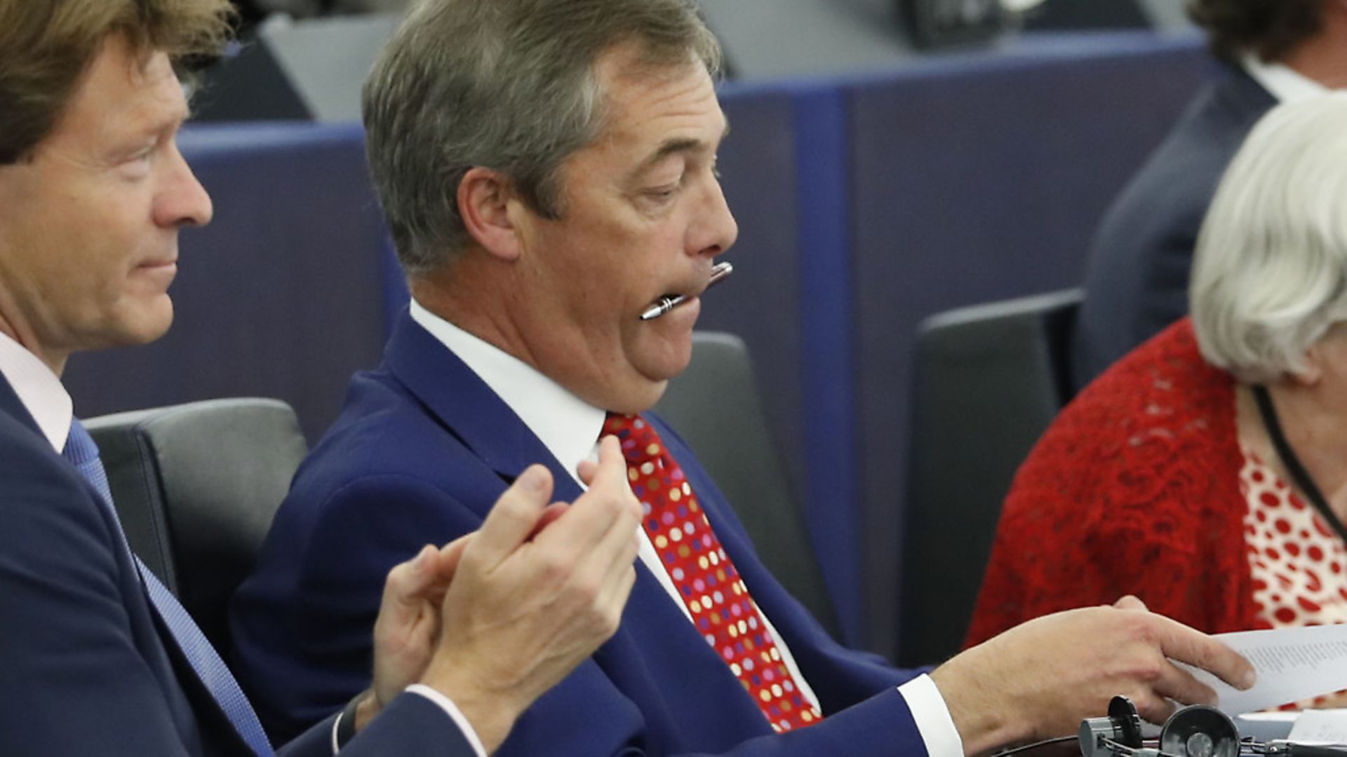 Brexit Party leader Nigel Farage bites a pen during a session at the European Parliament. (AP Photo/Jean-Francois Badias) - Credit: AP