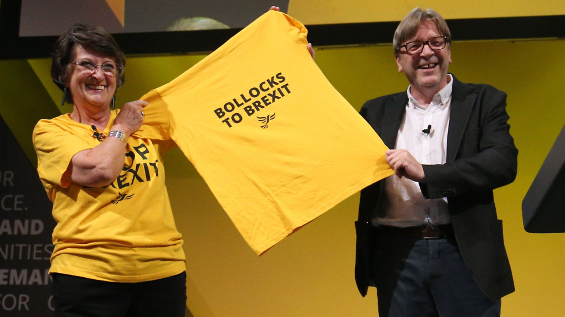 Guy Verhofstadt holds a 'Bollocks to Brexit' t-shirt with Catherine Bearder during Lib Dem party conference. Photograph: Jonathan Brady/PA Wire - Credit: PA Wire/PA Images
