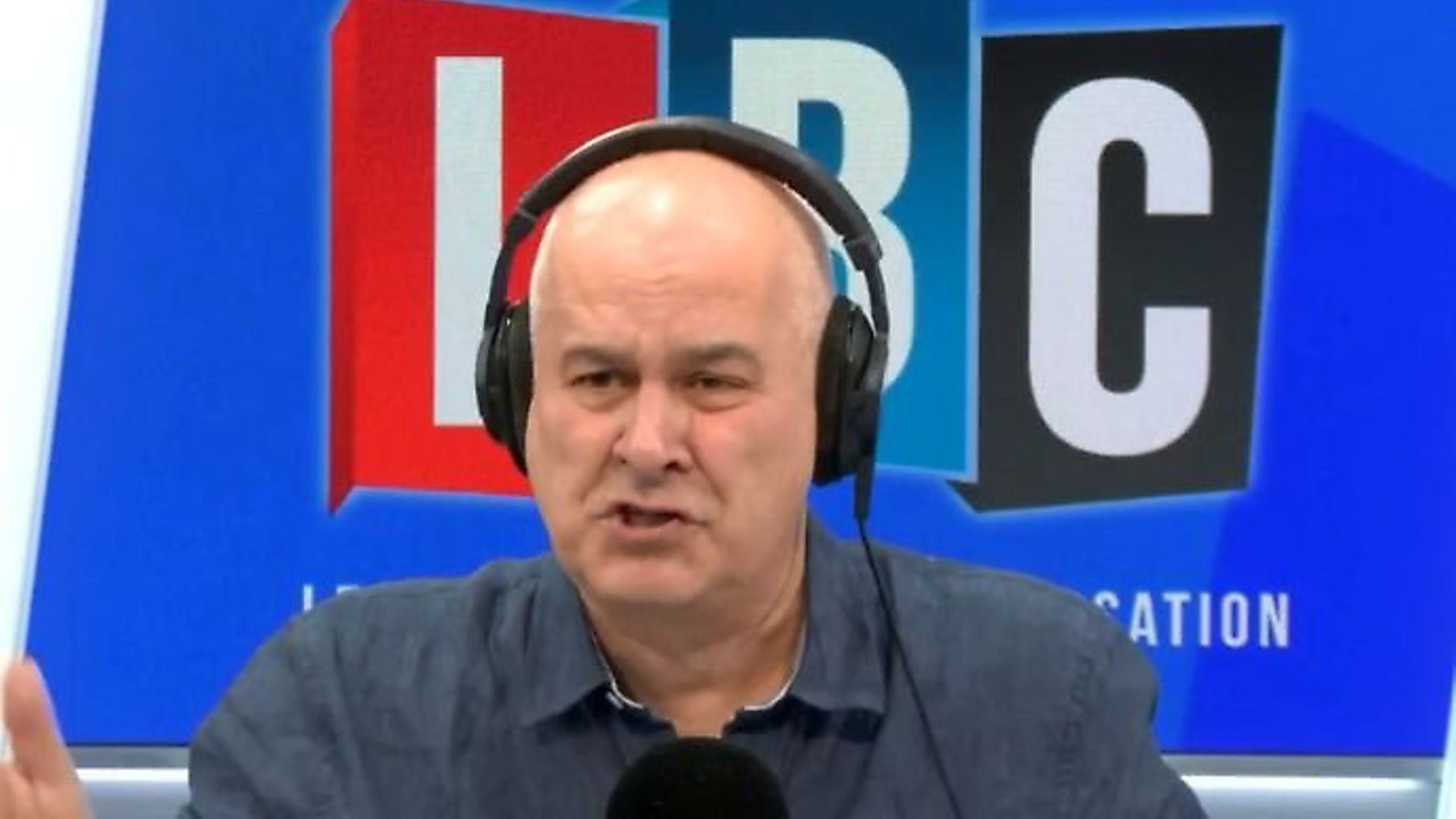 Iain Dale answers calls from listeners. Photograph: LBC. - Credit: Archant