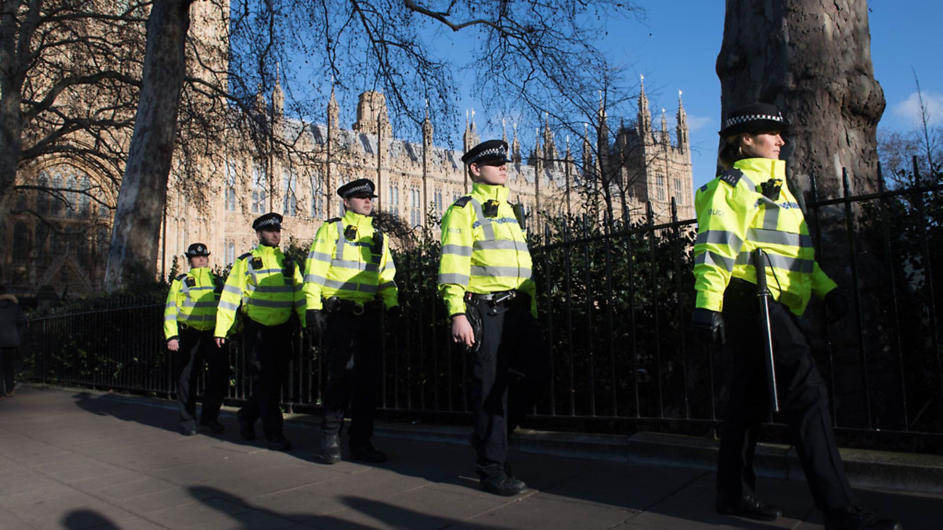 Metropolitan Police officers stand outside the Houses of Parliament in London. Photograph: Stefan Rousseau/PA. - Credit: PA Archive/PA Images