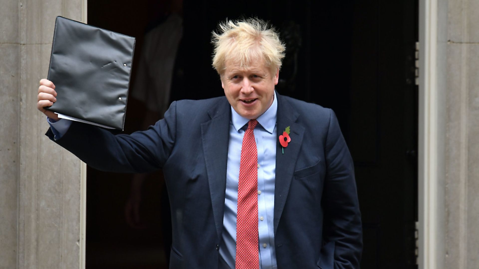 Boris Johnson waves a folder as he leaves 10 Downing Street. Photograph: Dominic Lipinski/PA Wire. - Credit: PA