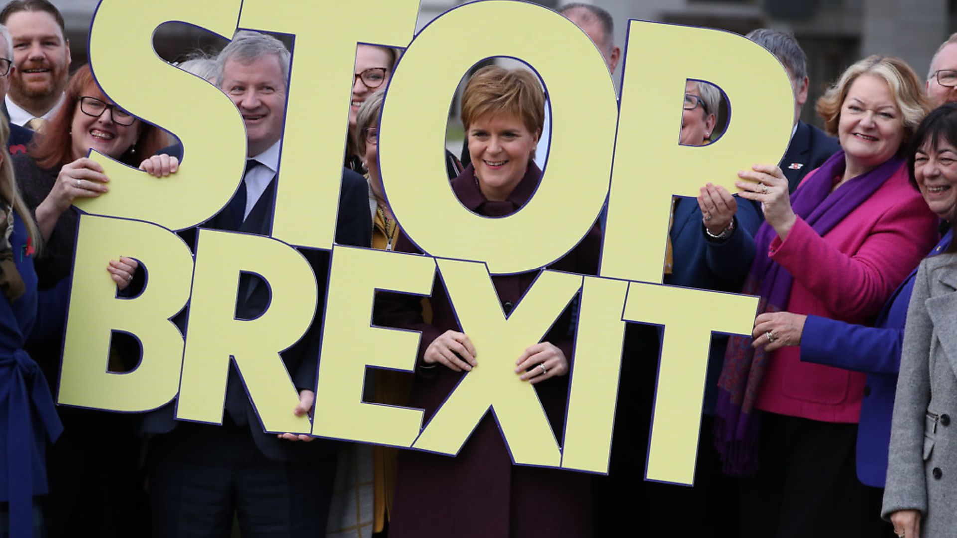 Scottish National Party candidates, including SNP Westminster leader Ian Blackford (centre left) and Nicola Sturgeon (centre), with a Brexit message during the general election campaign. Photograph: Andrew Milligan/PA Wire. - Credit: PA Wire/PA Images