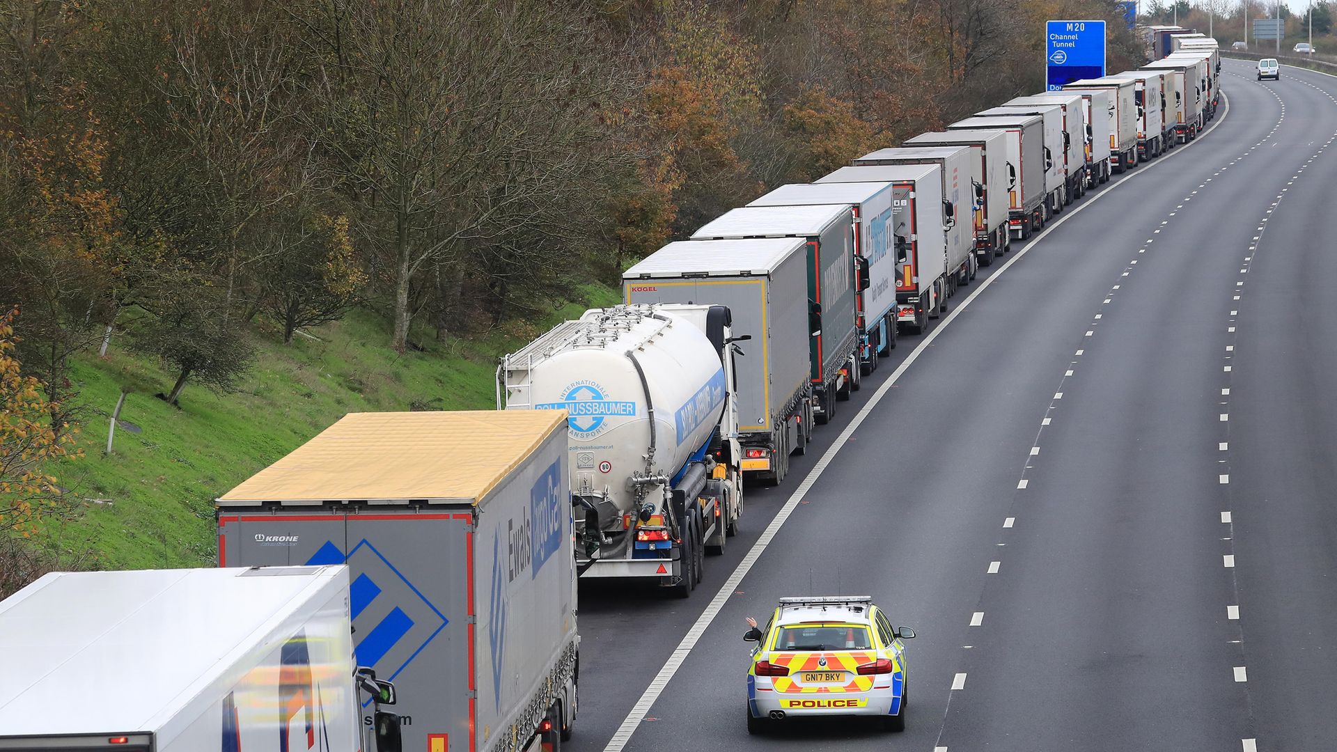 Freight lorries queueing along the M20 in Kent waiting to access the Eurotunnel terminal in Folkestone - Credit: PA
