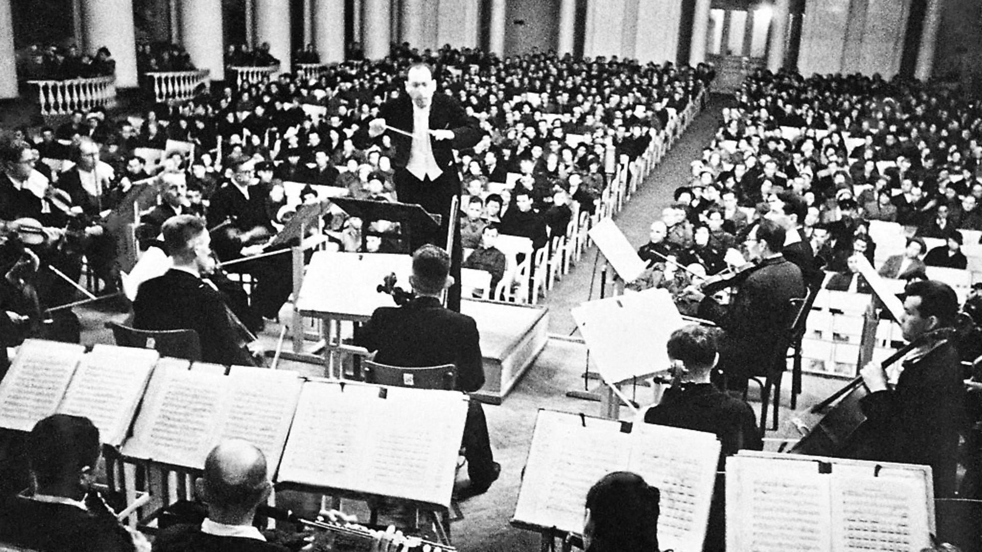 Conductor Karl Eliasberg leading the Saint Petersburg Philharmonic Orchestra as they perform Seventh Symphony by Dmitri Shostakovich during the siege of Leningrad. Picture: TASS via Getty Images - Credit: TASS via Getty Images
