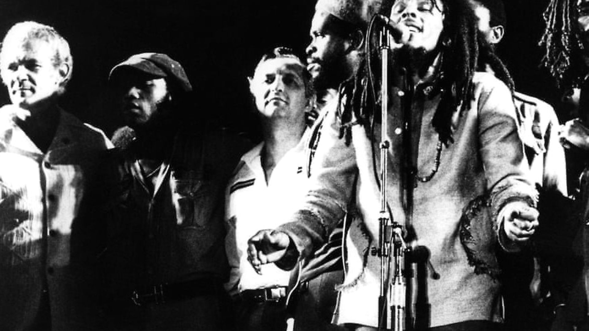 Bob Marley brought together the Jamaican prime minister Michael Manley (far left) and his political opponent Edward Seaga (third from left), together for a show of unity on stage at the 1978 One Love Peace concert in Kingston, Jamaica. Photograph: Echoes/Redferns - Credit: Archant