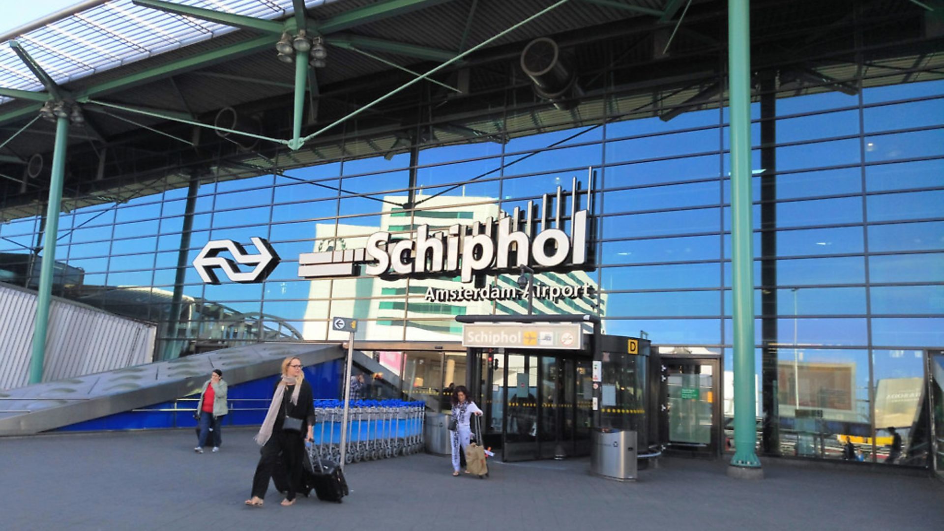 At Amsterdam's Schiphol airport, passengers are often told to 'keep' passports ready. Why do British airports say 'have'? Photo: Wikicommons - Credit: Archant