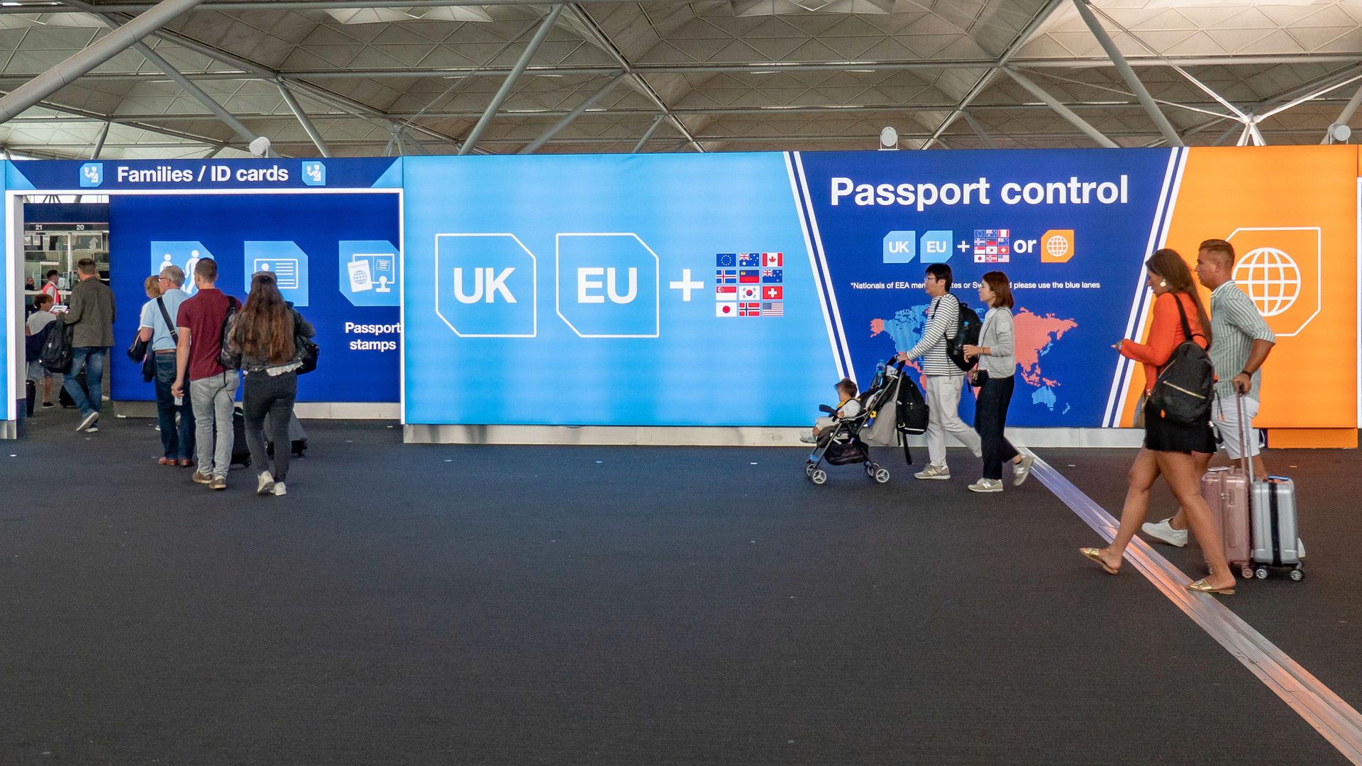 Signs at passport control at Stansted airport in England - Credit: NurPhoto via Getty Images