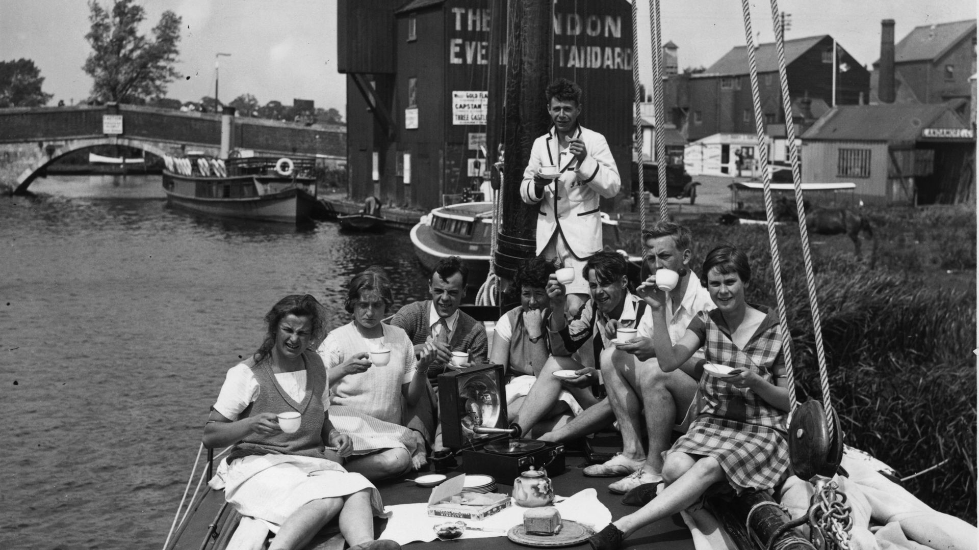 Messing about in 'boots' - holidaymakers relax on board their vessel in Peter's native Norfolk in 1926 - Credit: Getty Images