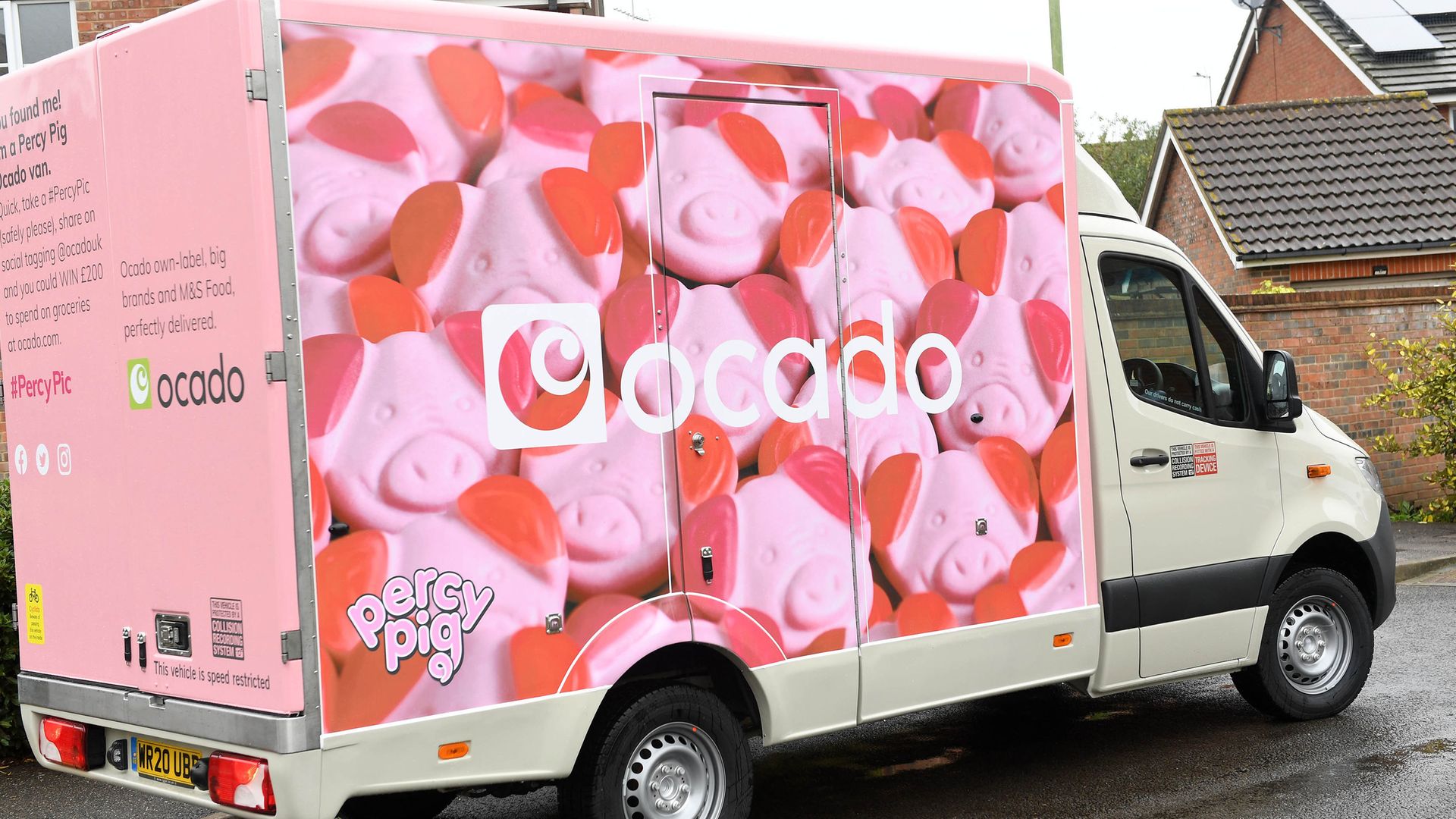 A fleet of limited-edition Percy Pig delivery vans are unveiled as Ocado marks the arrival of the full M&S Food range to the online supermarket's website - Credit: PA