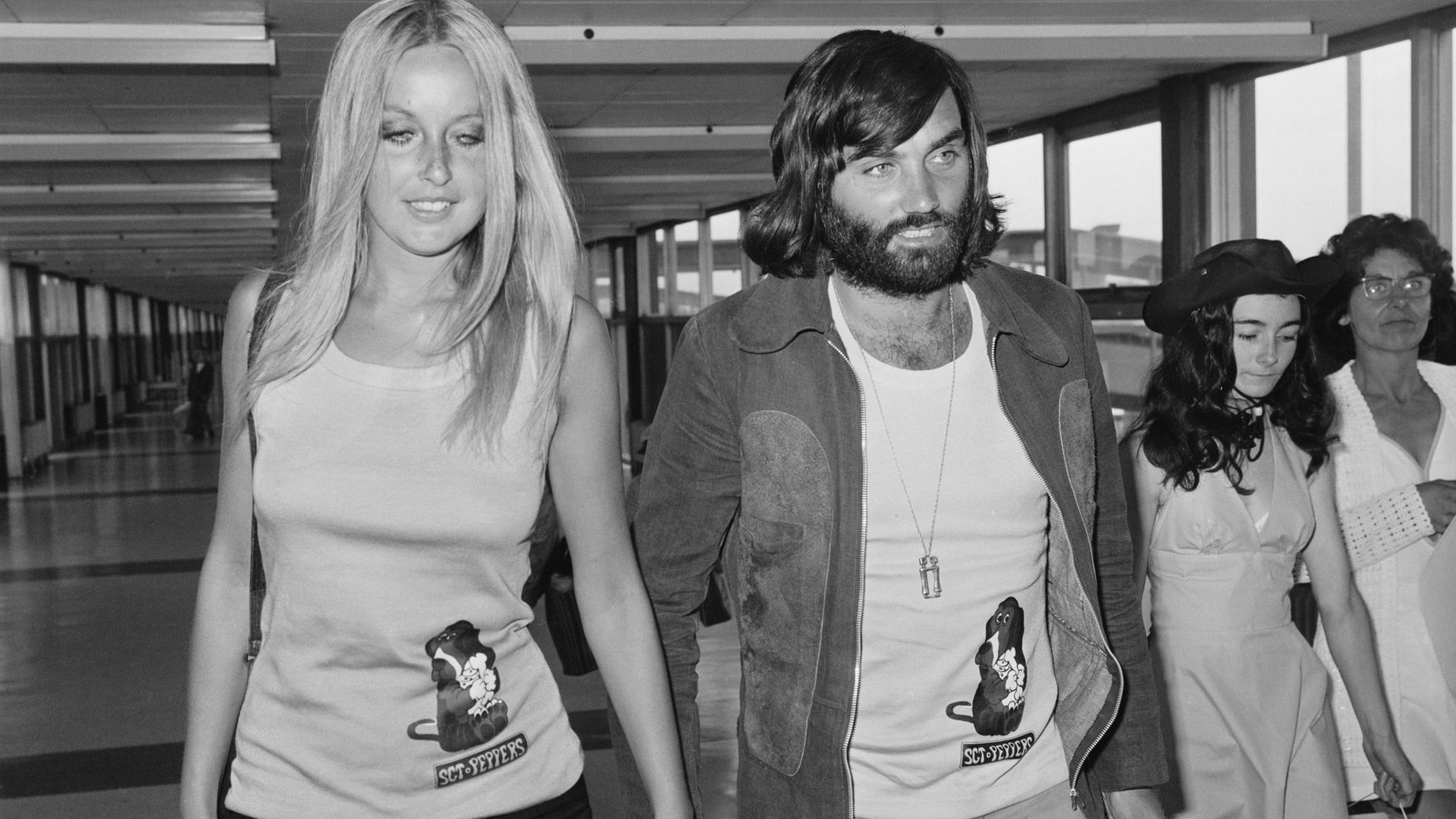 George Best with girlfriend, Swedish actress and model Mary Stavin, at Heathrow Airport in 1973, the year before he signed for South Africa's Jewish Guild - Credit: Getty Images