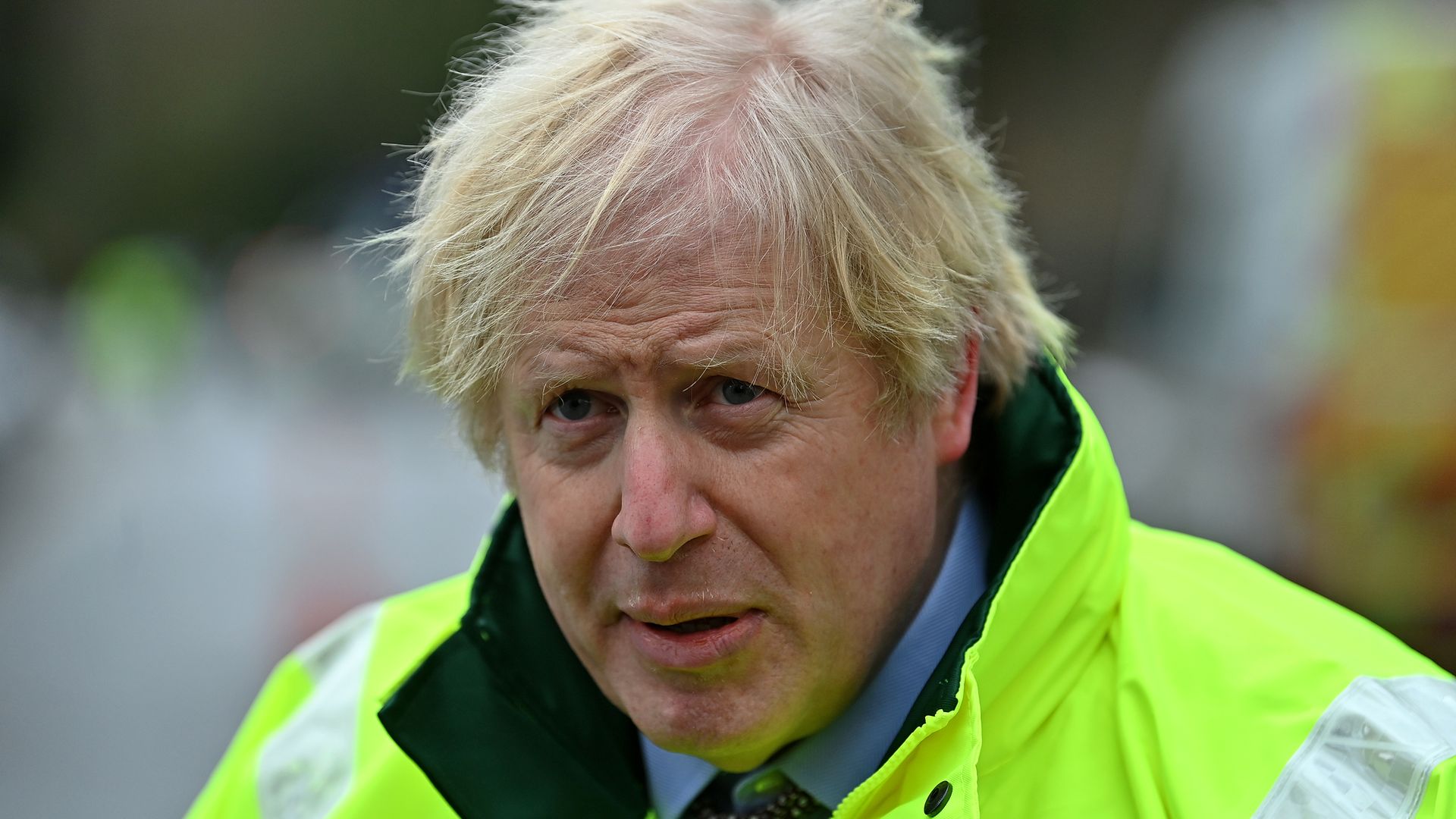 Prime minister Boris Johnson talks to members of the media after being shown the Environment Agency's flood defence preparations put in place for Storm Christoph during a visit to Withington, Manchester - Credit: PA