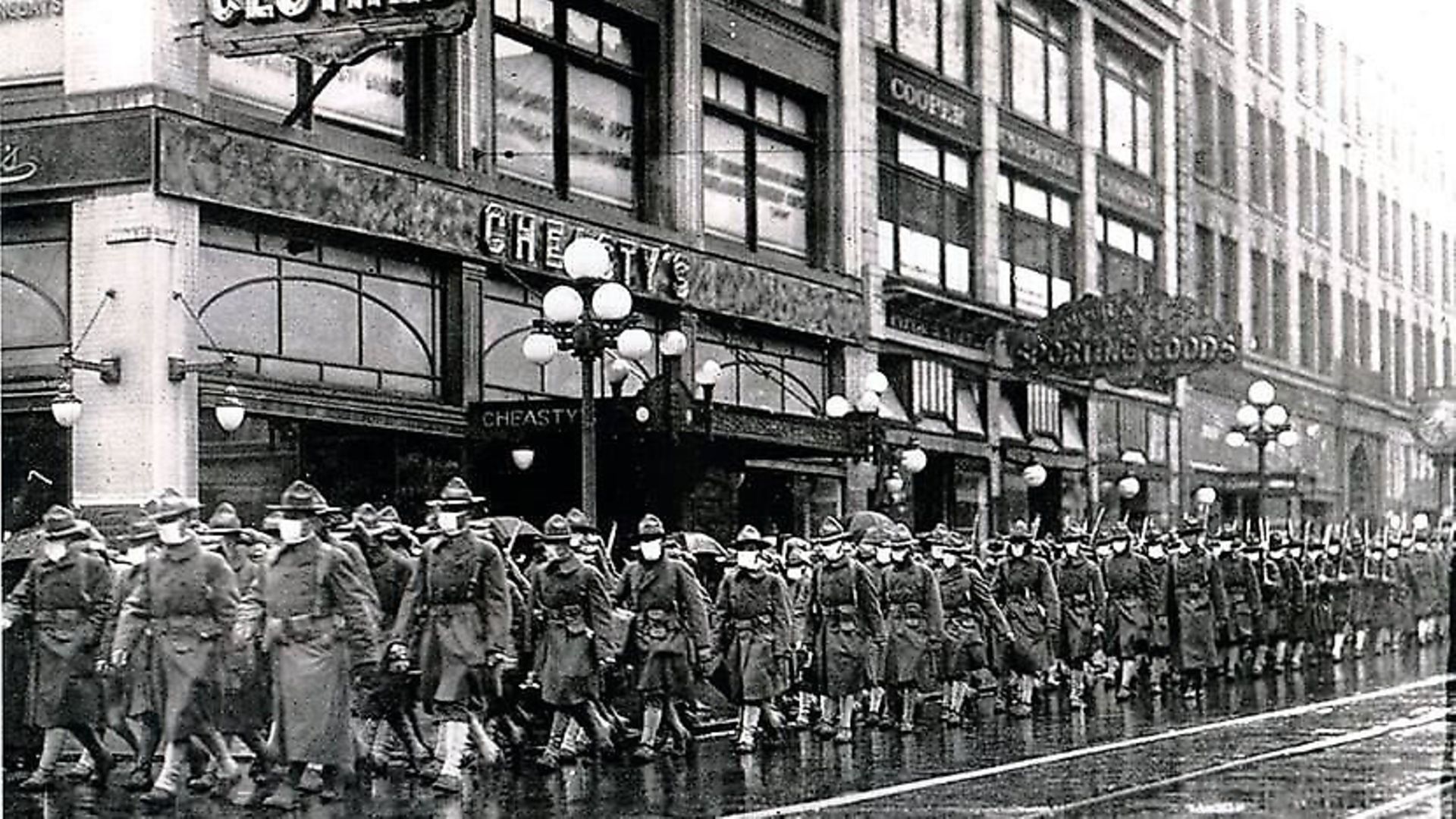 The 39th Regiment, wearing masks to protect soldiers from the flu virus, marches through the streets of Seattle in December 1918 Photo: ©Atlas Archive / The Image Works. - Credit: Archant