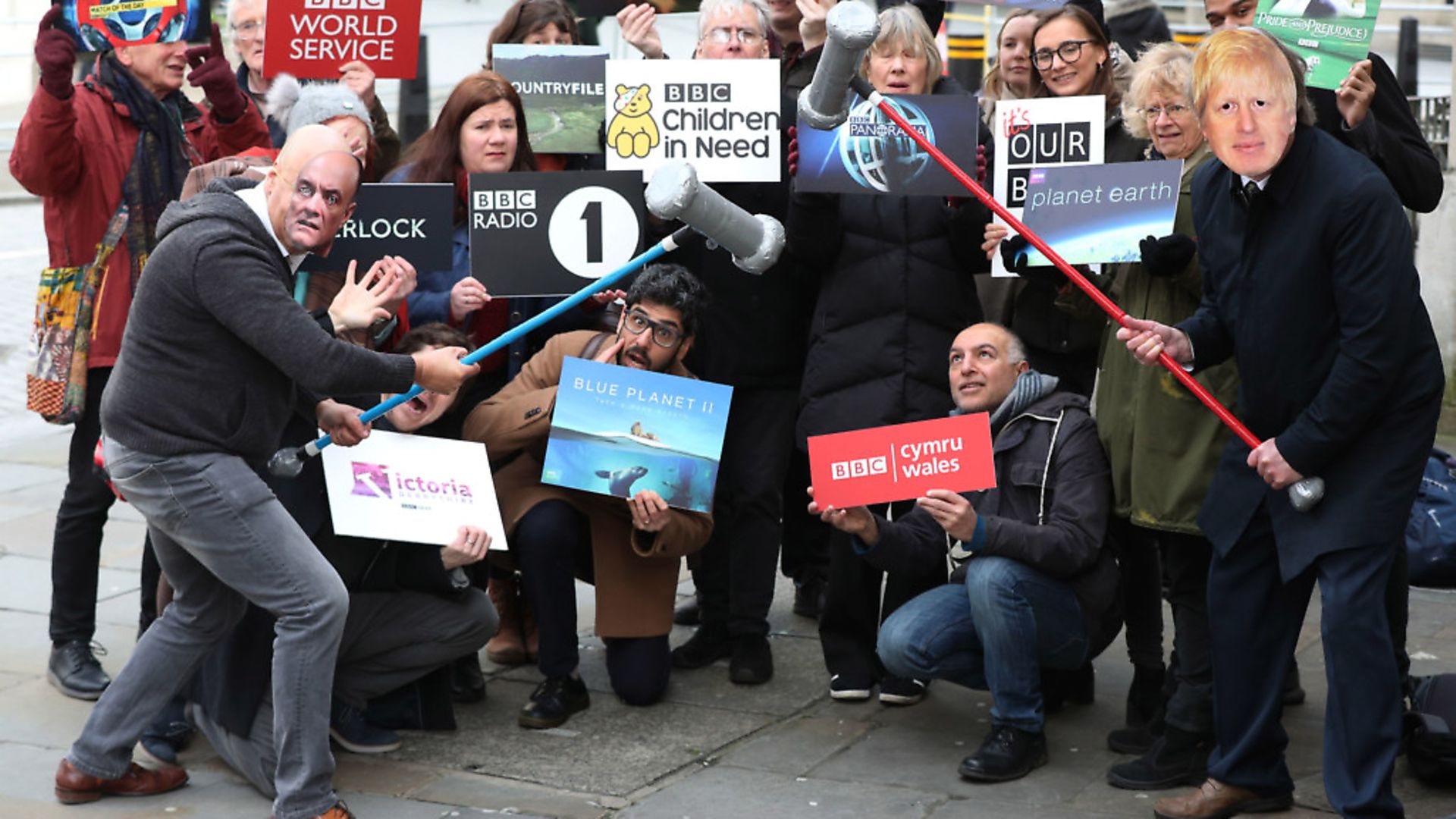 Activists impersonating Dominic Cummings and Boris Johnson take part in a 'whack a mole' photo call outside BBC New Broadcasting House in London, during the launch of the 'It's Our BBC' campaign to defend the broadcaster. PA Photo. Photograph: Jonathan Brady/PA Wire. - Credit: PA