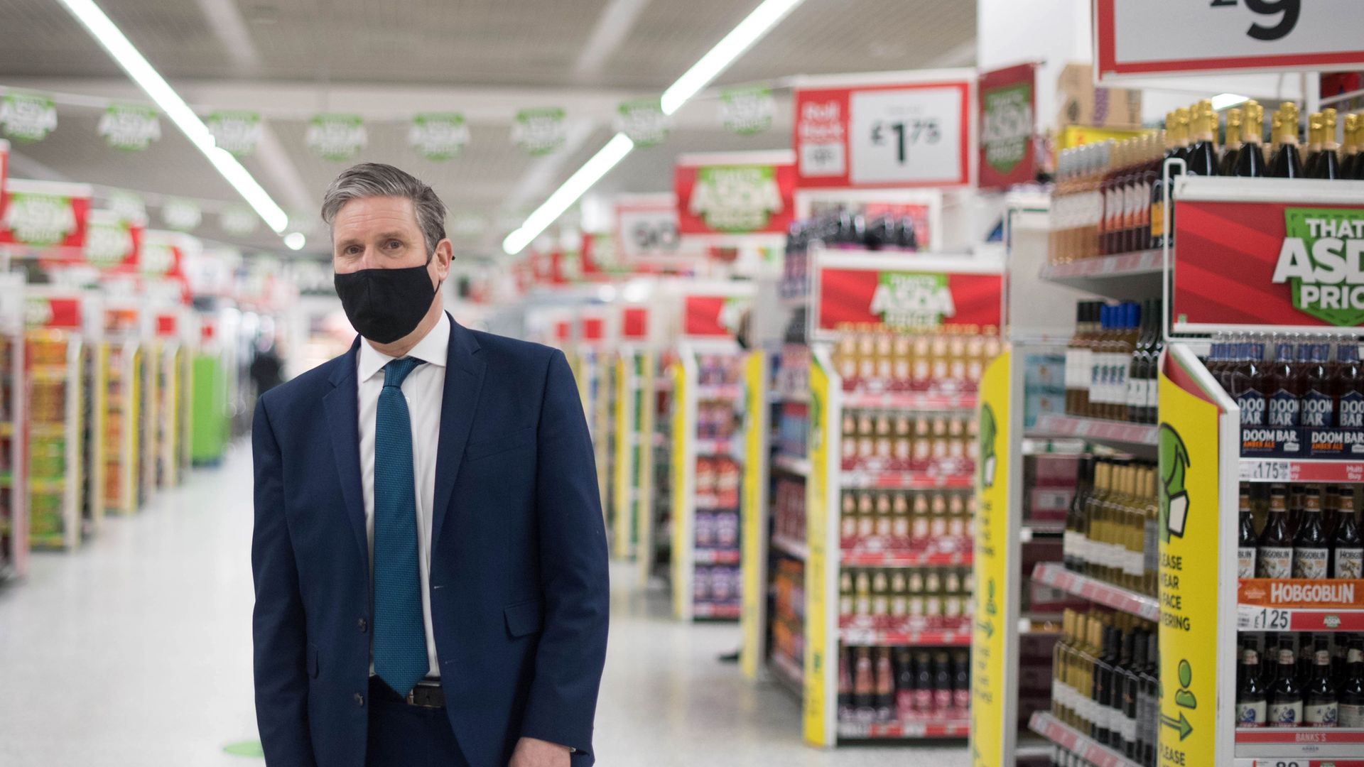 CHECKING OUT?: Keir Starmer during a visit to a community pharmacy vaccination centre set up inside an ASDA supermarket in Watford - Credit: POOL/AFP via Getty Images