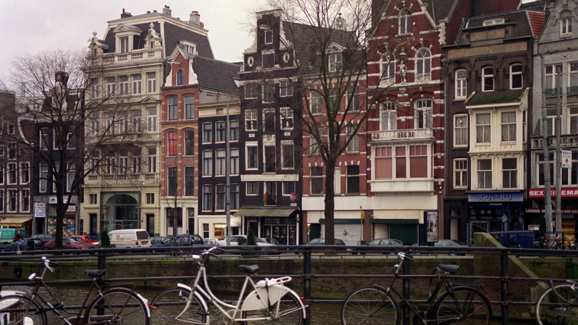 Bicycles leaning against the railings, on one of the bridges over the canal in Holland's capital city, Amsterdam.