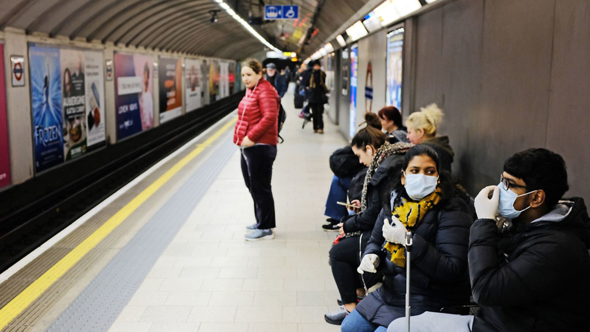 People wearing face masks in King's Cross tube station in London. Photograph: Ian Hinchliffe/PA Wire. - Credit: PA
