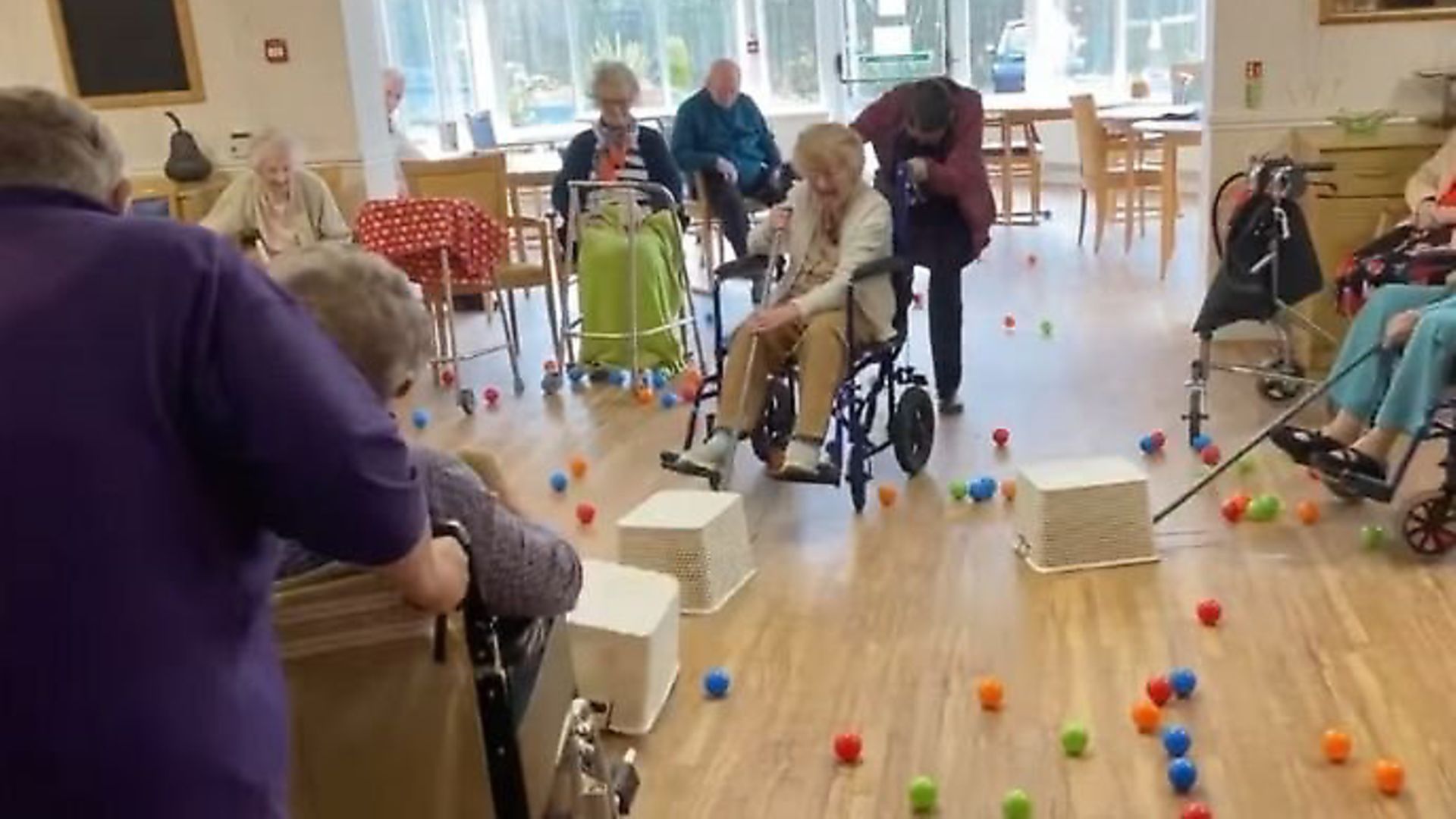 Residents of Bryn Celyn Care Home play a life-size version of Hungry Hippos. Photograph: Facebook. - Credit: Archant