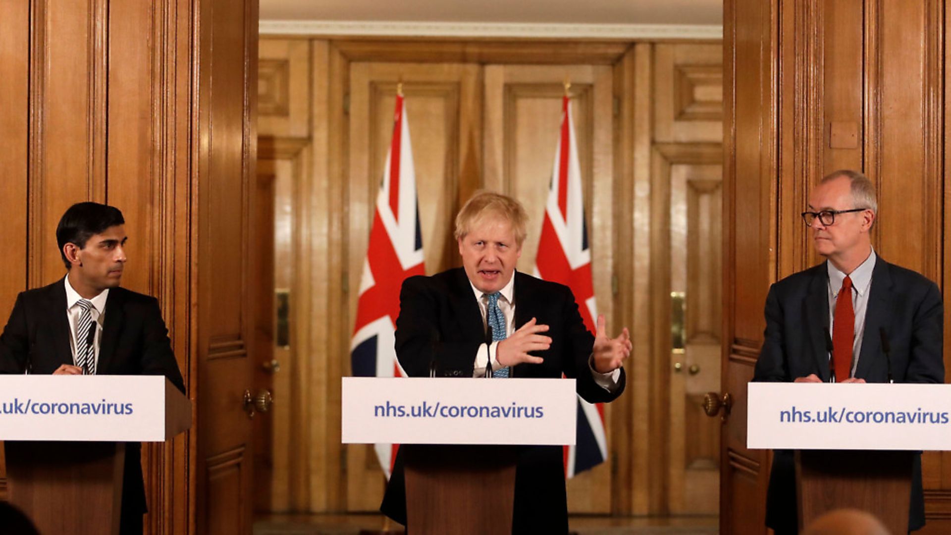 Prime minister Boris Johnson alongside chief scientific adviser Patrick Vallance (right) and chancellor Rishi Sunak during a daily news conference amid the coronavirus outbreak. Picture: Getty Images - Credit: POOL/AFP via Getty Images