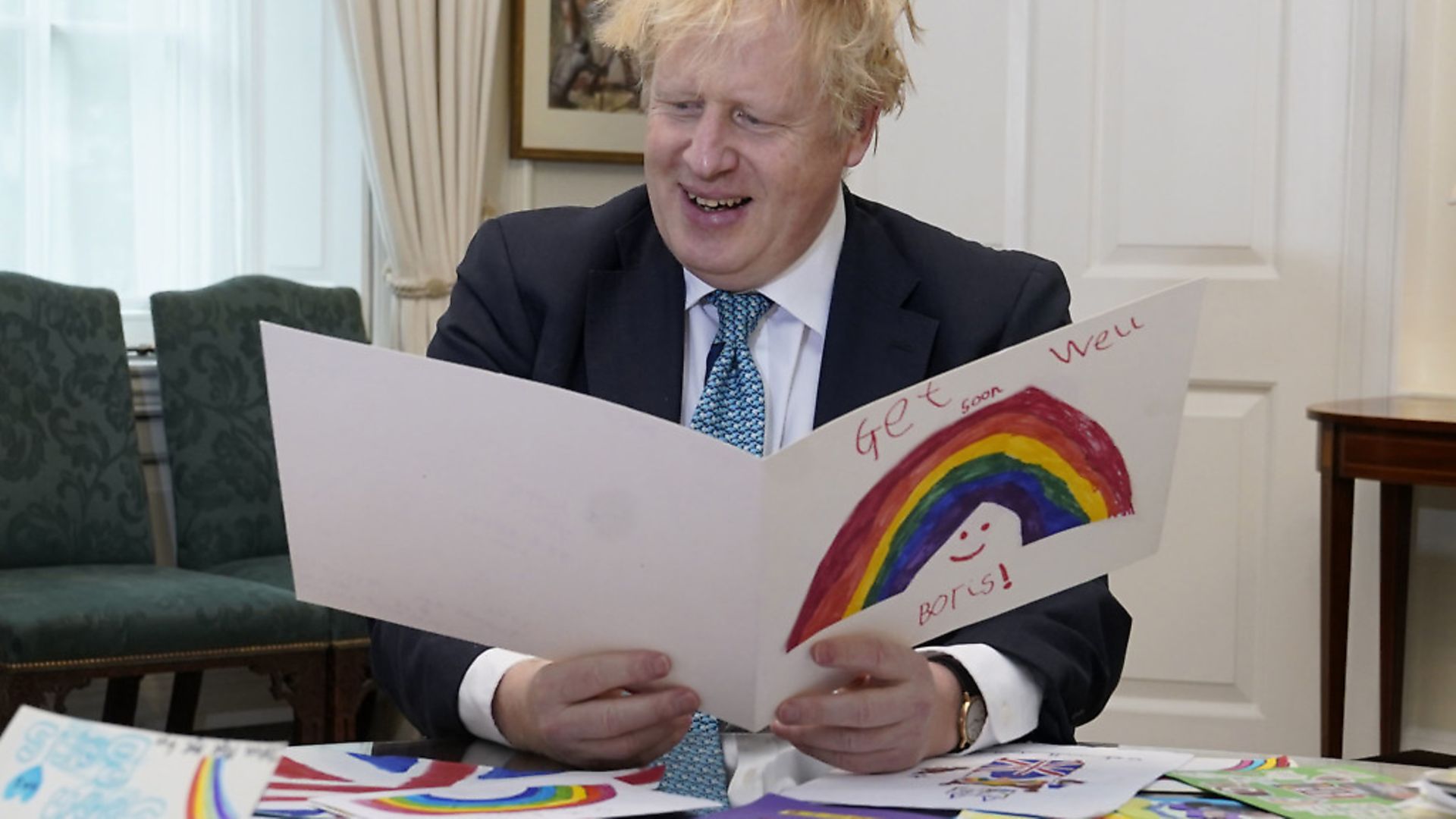 Prime Minister Boris Johnson in his office in No10 Downing Street with all his get well soon cards sent in by children while he was ill with the coronavirus. Photograph: Andrew Parsons/10 Downing Street/Crown Copyright/PA Wire. - Credit: PA