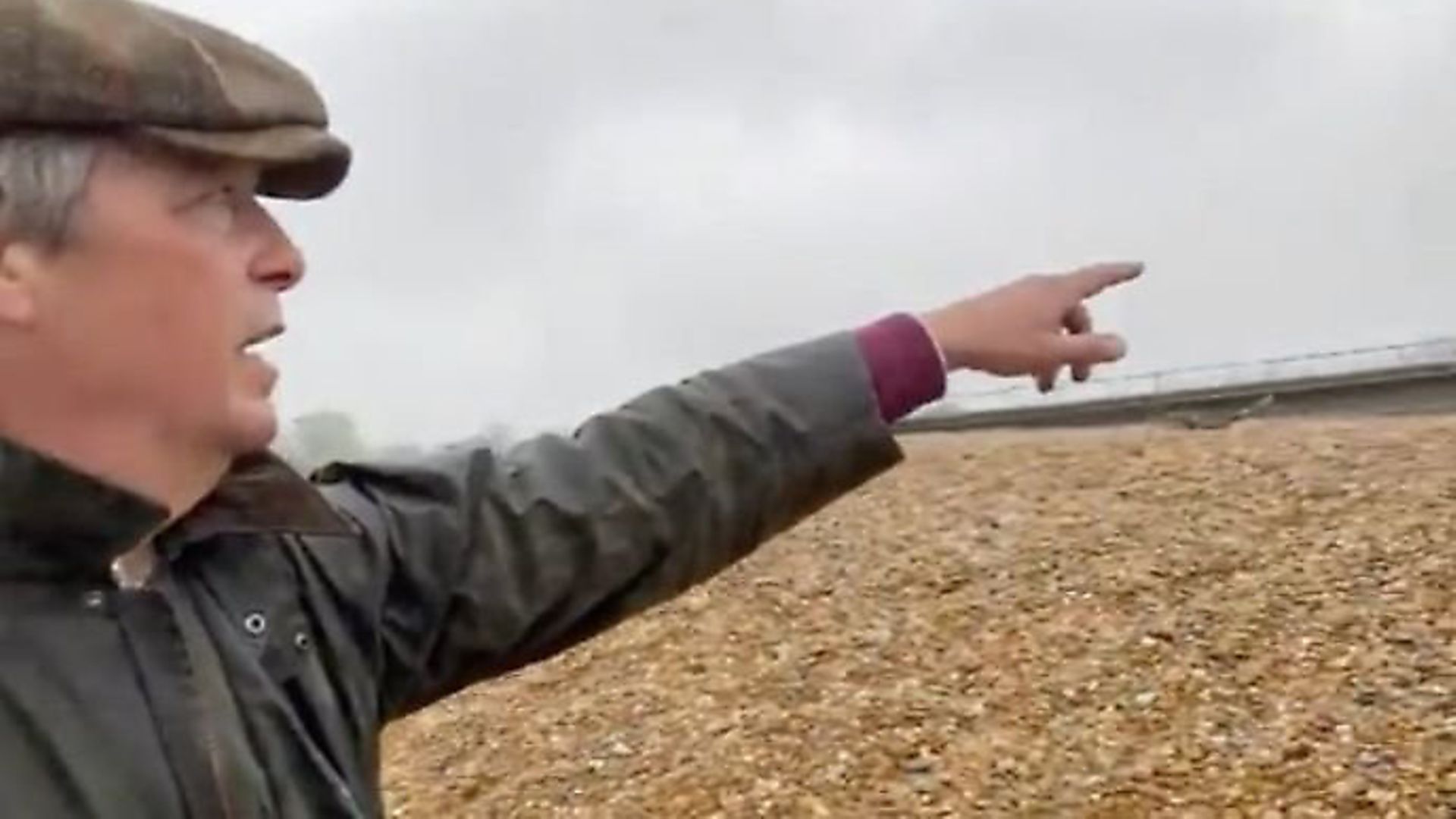 Nigel Farage appears to flout coronavirus rules to film a video rant on a beach. Photograph: Twitter. - Credit: Archant