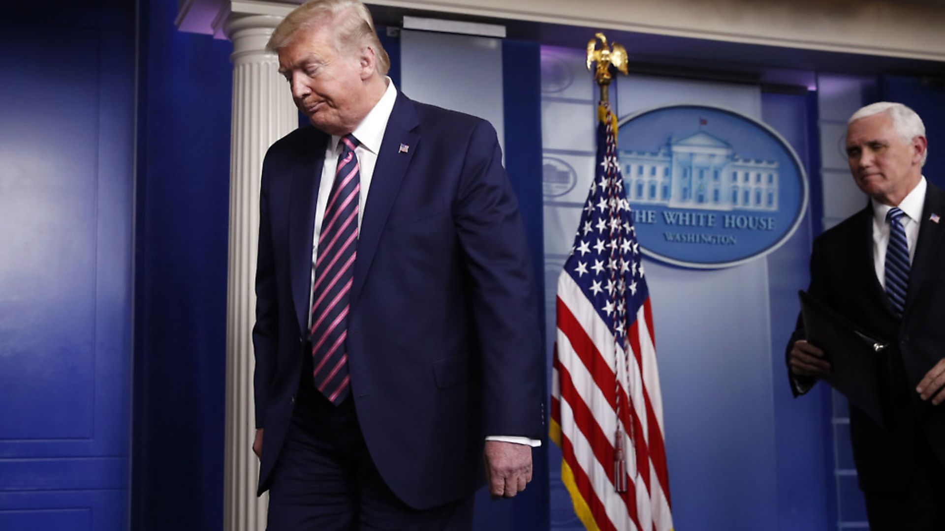 President Donald Trump and Vice President Mike Pence leave at the end of a briefing about the coronavirus in the James Brady Press Briefing Room of the White House. (AP Photo/Alex Brandon) - Credit: AP