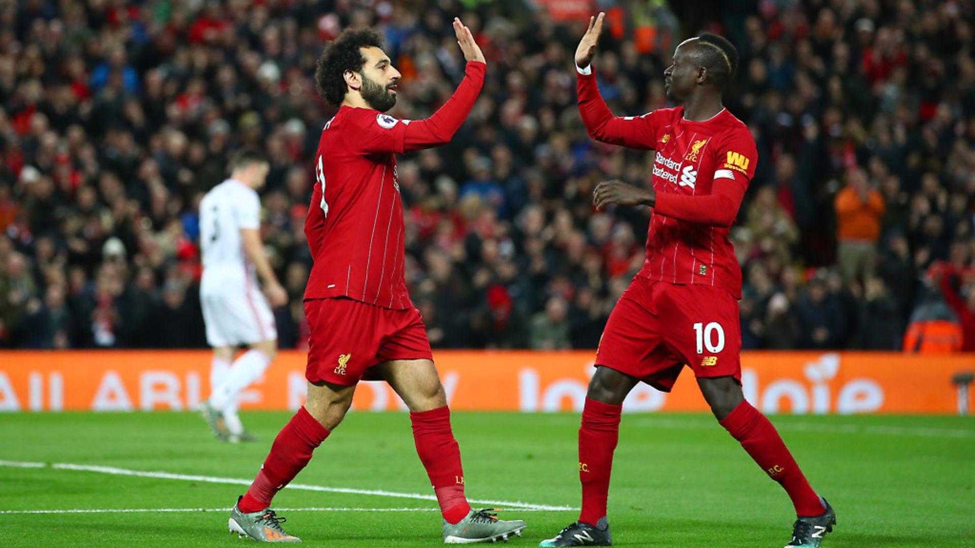 Mohamed Salah of Liverpool celebrates with Sadio Mane after scoring his team's first goal during the Premier League match between Liverpool FC and Sheffield United at Anfield. Picture: Clive Brunskill/Getty Images - Credit: Getty Images