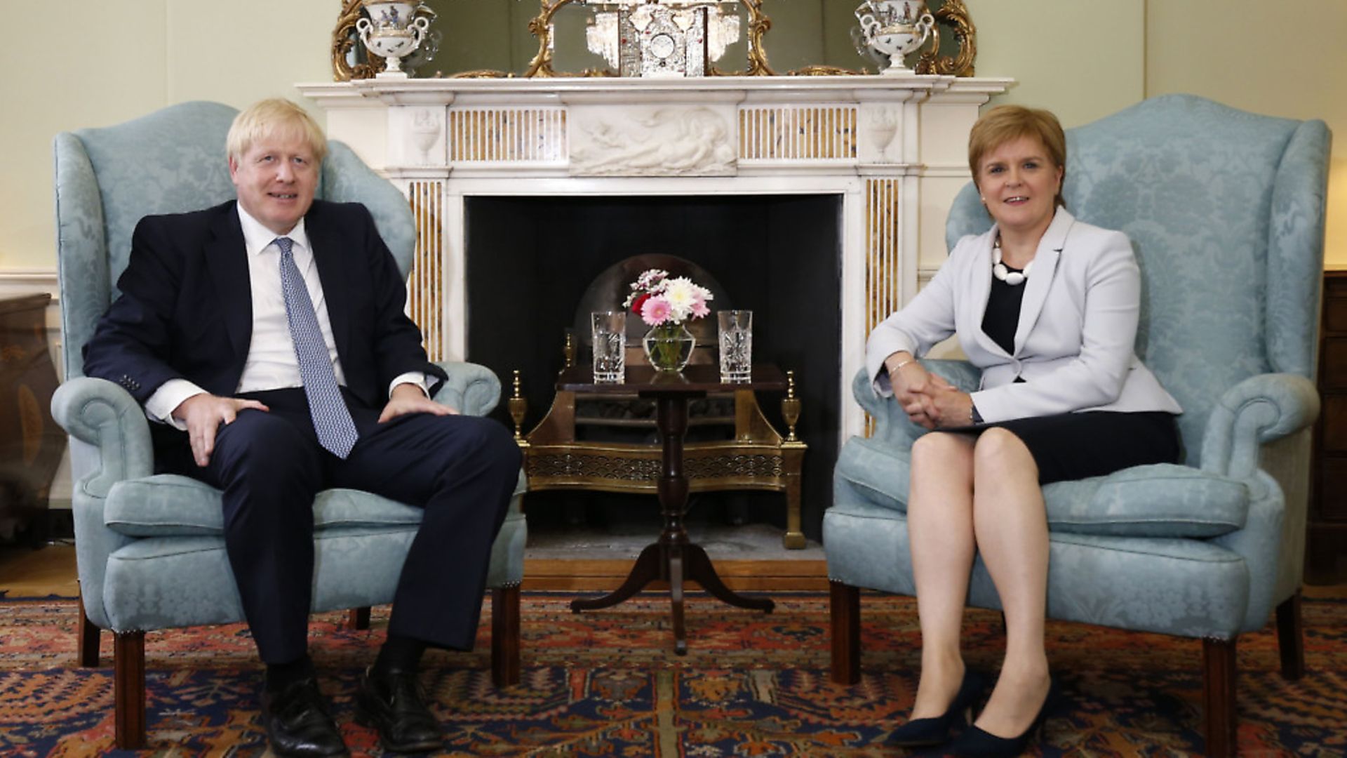 Britain's Prime Minister Boris Johnson (L) and Scotland's First Minister Nicola Sturgeon (R) pose for a photograph before talks at Bute House in Edinburgh. (Photograph: DUNCAN MCGLYNN/AFP via Getty Images) - Credit: AFP via Getty Images