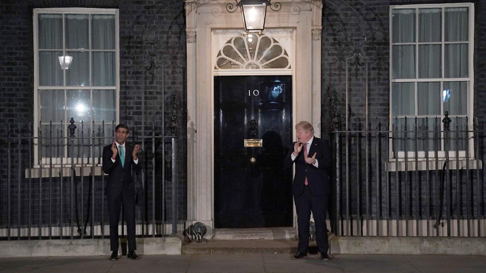 Chancellor Rishi Sunak and Prime Minister Boris Johnson applauding outside 10 Downing Street in a gesture of thanks to the hardworking NHS staff. Picture: Aaron Chown/PA - Credit: PA