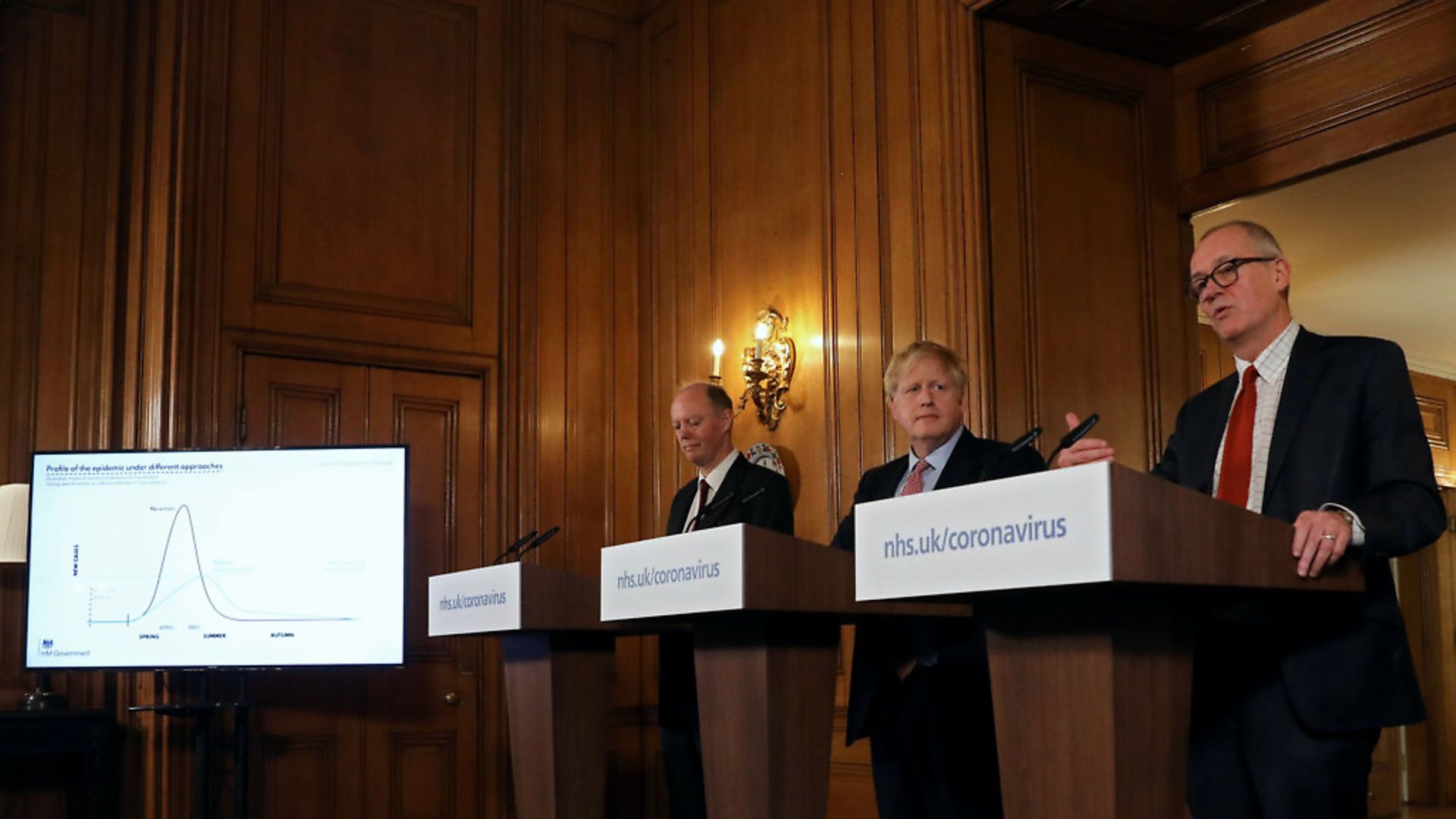 Prime Minister Boris Johnson, alongside Chief Medical Officer for England Chris Whitty (left) and Chief Scientific Adviser Sir Patrick Vallance (right) during a press briefing on coronavirus. Photograph: Simon Dawson/PA. - Credit: PA