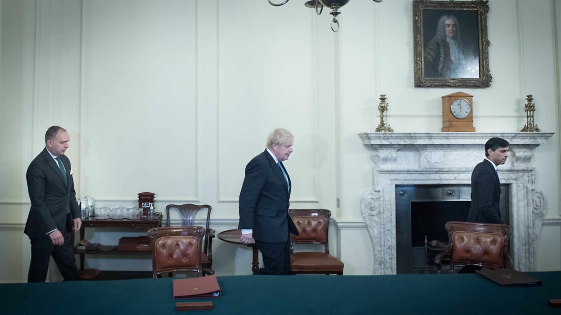 Prime Minister Boris Johnson (centre) arrives with Cabinet secretary, Mark Sedwill (left) and Chancellor Rishi Sunak (far right) in the Cabinet Room inside 10 Downing Street. Photograph: Stefan Rousseau/PA Wire. - Credit: PA