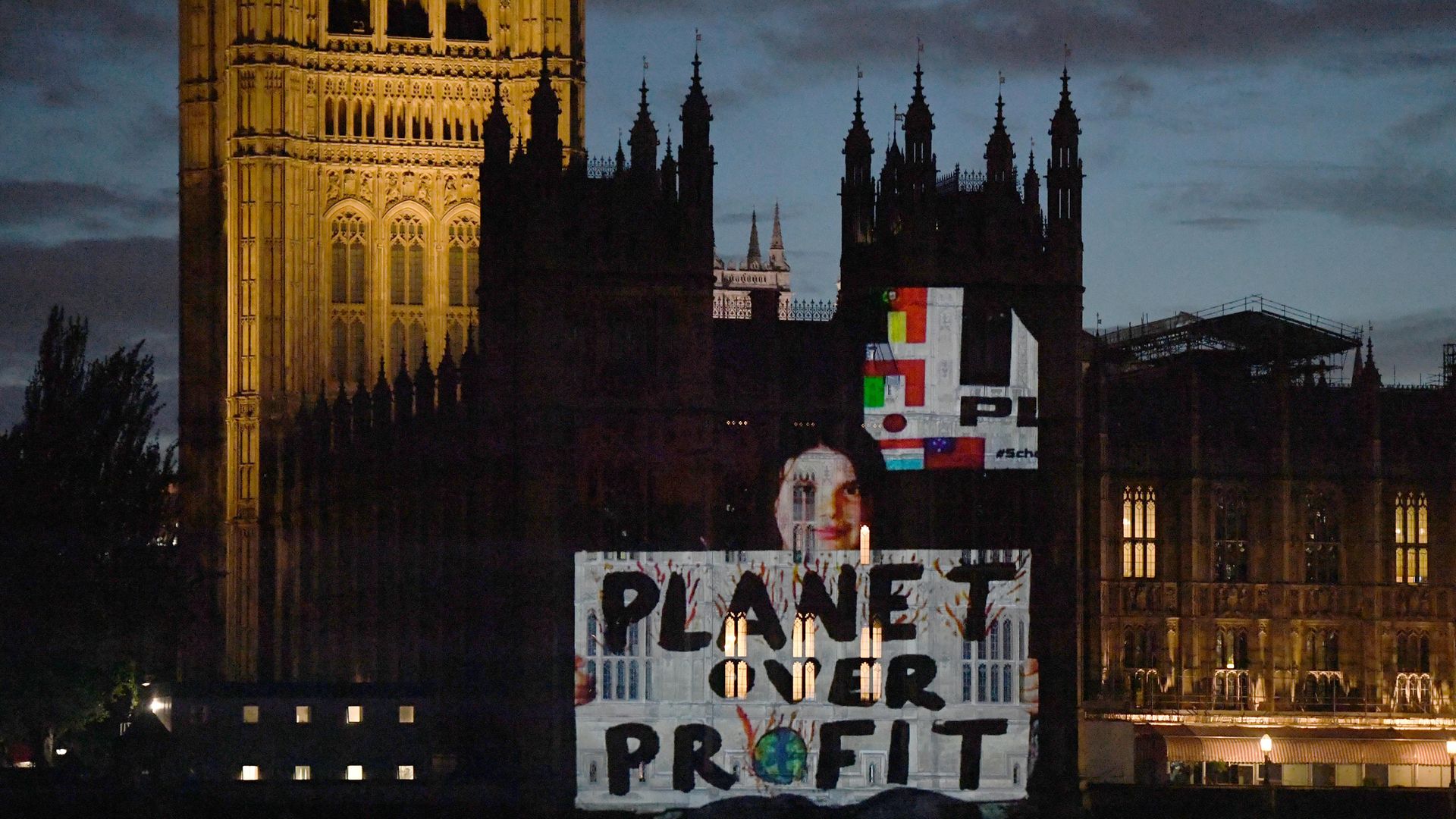 London for School Strike for Climate Change project their message to Boris Johnson on to the Houses of Parliament - Credit: PA